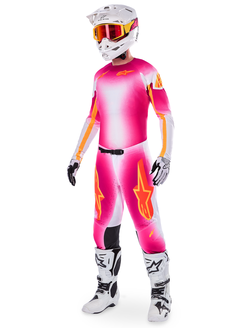Motocrossförare i Alpinestars Supertech AFD MIG Limited Edition-ställ, tröja och byxor med färgtoning i neonrosa, vitt och orange, vit hjälm med orangea goggles, vita och svarta stövlar, professionell motocrossutrustning