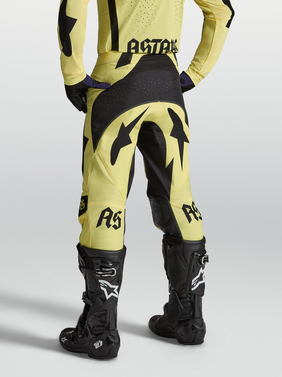 Yellow and black Alpinestars Techstar Atrox Pants, athletic-fit motocross racing gear for aggressive off-road riding.
