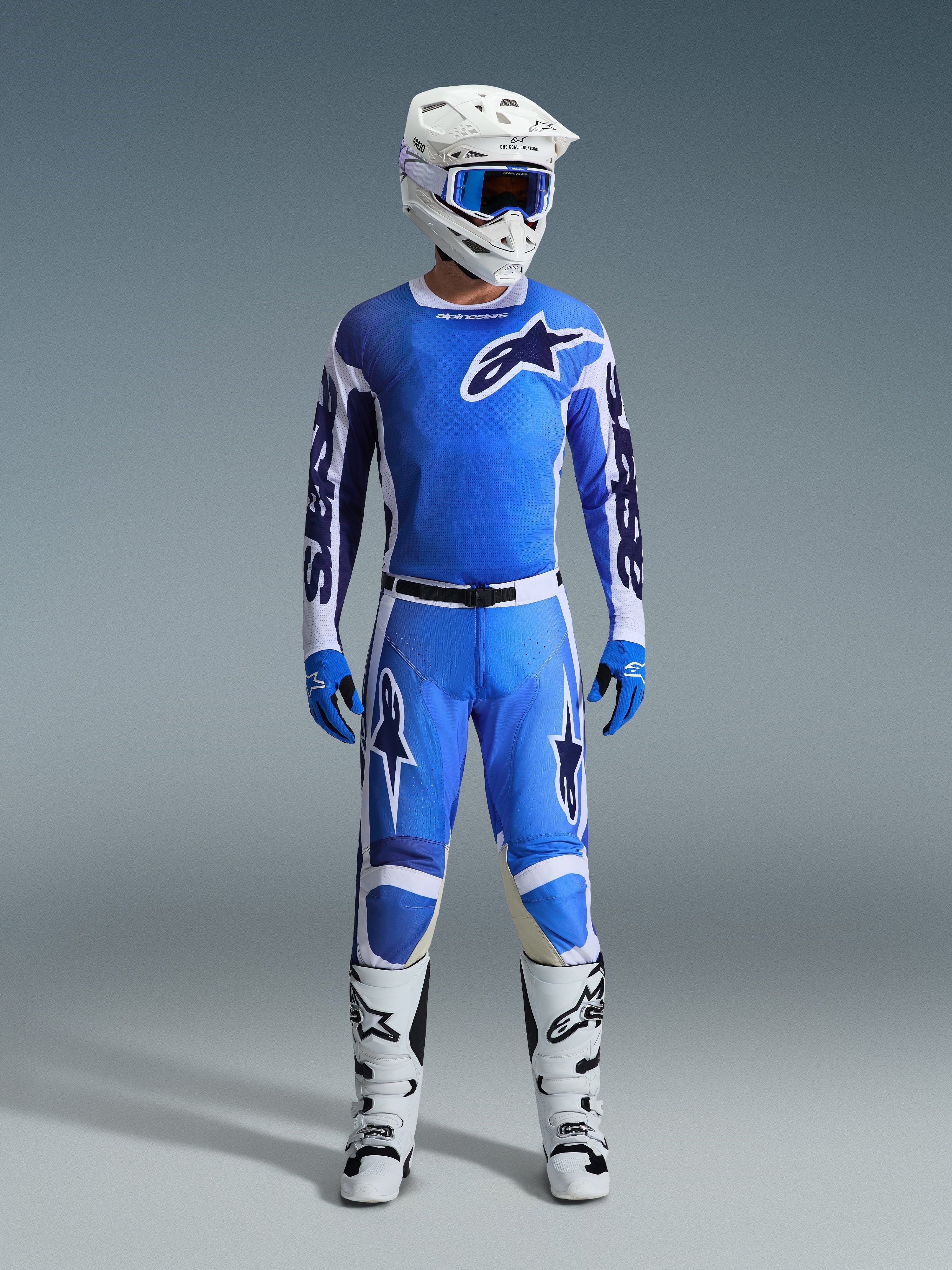 Alpinestars 2026 Racer Air Portl Gear Set, Motocross Racing Gear, Ucla Blue and White, complete outfit featuring a ventilated jersey, perforated pants with magnetic buckle, blue gloves, white boots, and a white helmet with blue goggles, high-performance breathable design for off-road riding