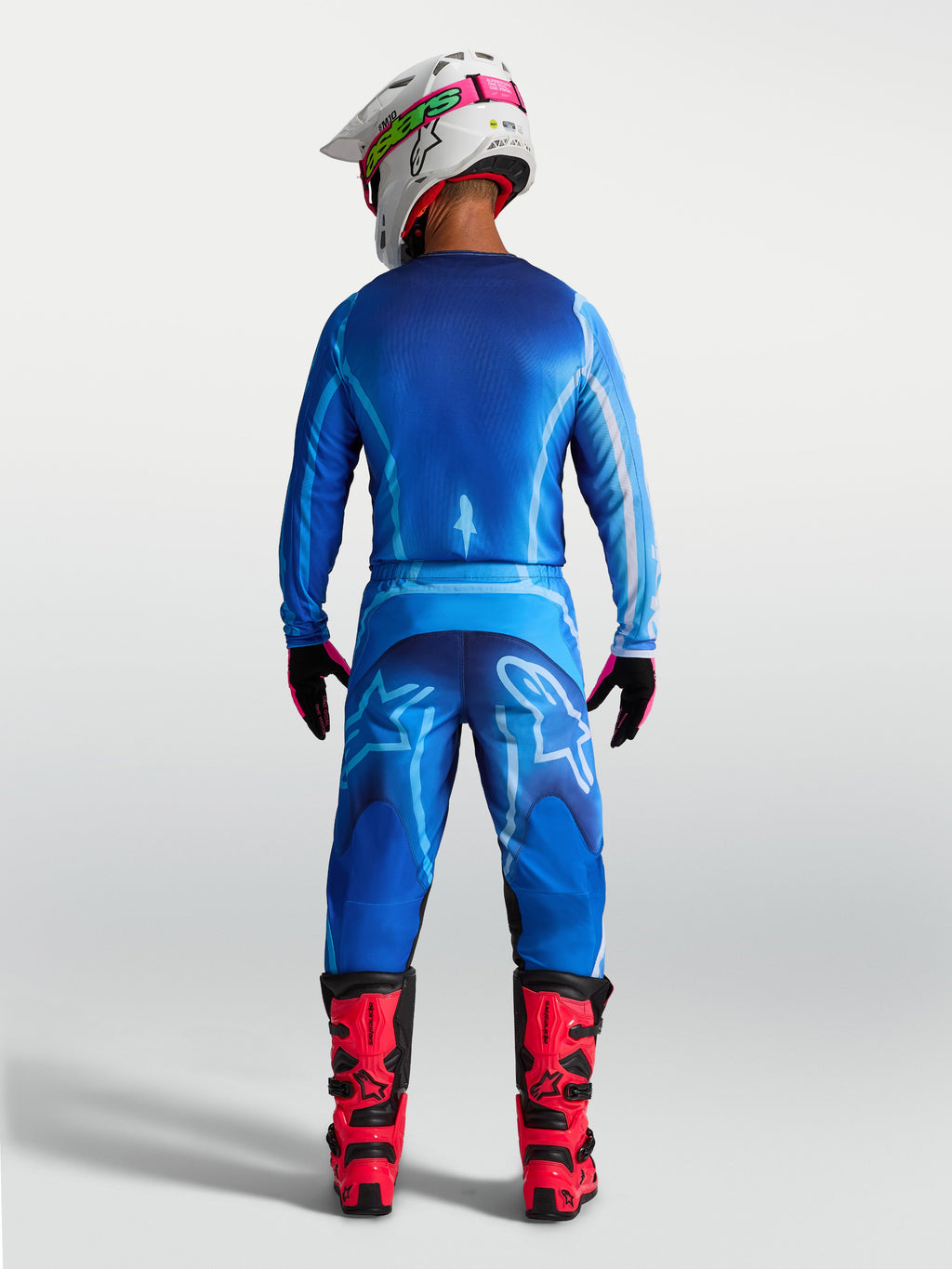 Alpinestars Fluid Kepler byxor, blå herrmotocrossbyxor, vy bakifrån som visar ergonomisk passform i hållbart polytyg.