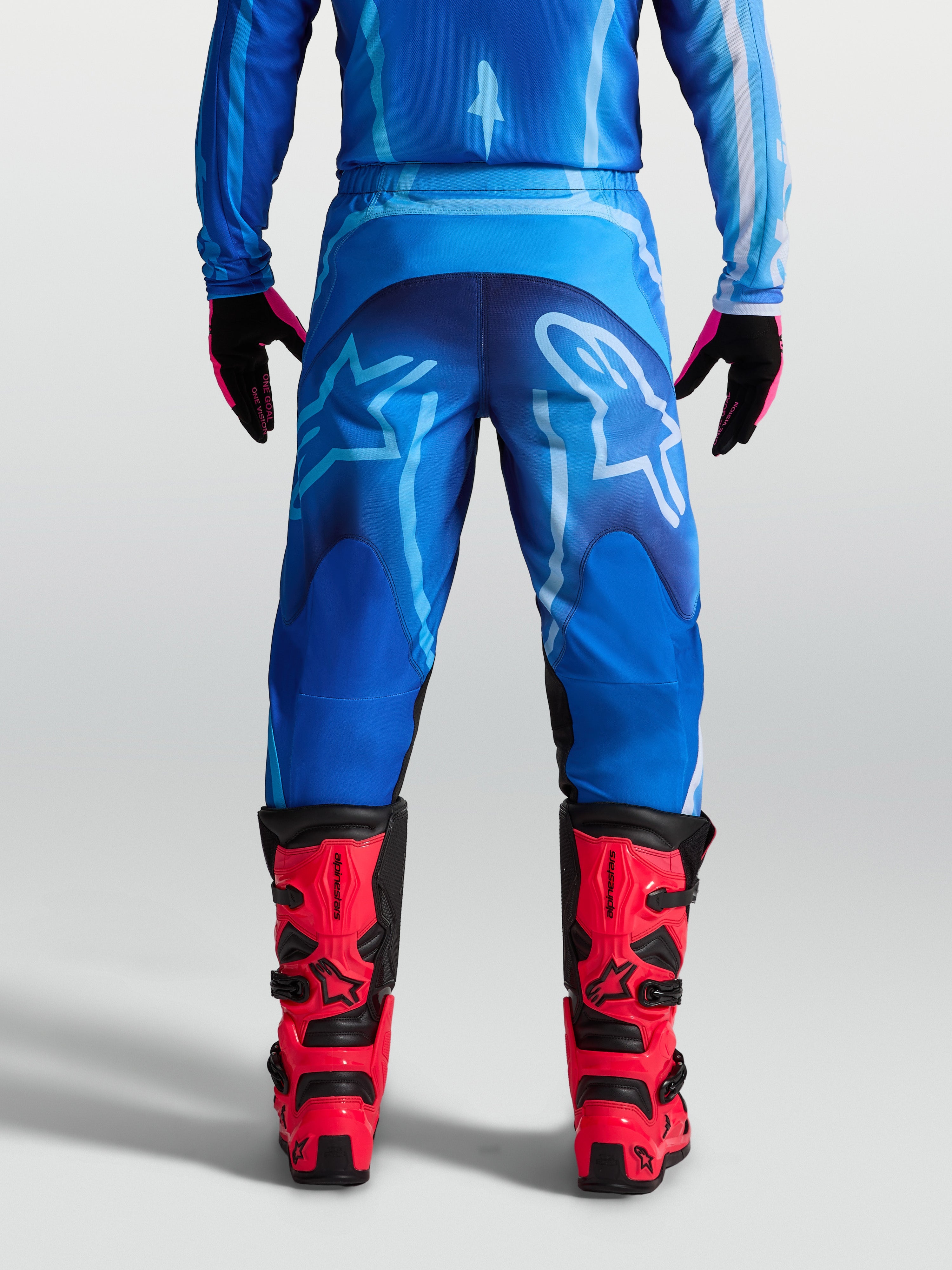 Alpinestars Fluid Kepler byxor, blå motocrossbyxor för herrar i 600D polytyg, baksida sedd på modell