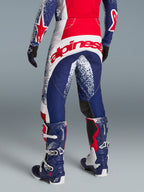 Alpinestars Limited Edition Techstar Unity Pants, Red, White, and Blue Motocross racing gear with a large rear logo on-model.