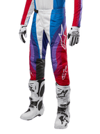 Alpinestars 2024 Techstar Pneuma byxor, motocrossbyxor, Blu Mars Red White, bärs med matchande tröja, vita racingstövlar och handskar, livfull grafisk design med röda, blå och lila accenter, perforerade för andningsförmåga