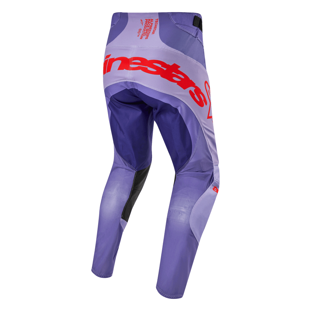 Alpinestars 2024 Techstar Ocuri byxor, lila motocrossbyxor sedda bakifrån med stor orange logotyp över sätet, ventilationspaneler och slitstarka material för terrängkörning