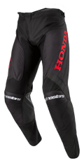 Alpinestars Honda Racer Iconic byxor, motocrossbyxor, svarta med röd branding, med en stor röd Honda-logotyp på låret och vit Alpinestars-text på knäna, sportig skärning för offroad-prestanda