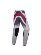 Alpinestars 2027 Supertech Swan ungdomsbyxor, gråa och röda motocrossbyxor med stor logotyp bak och ventilerade paneler.