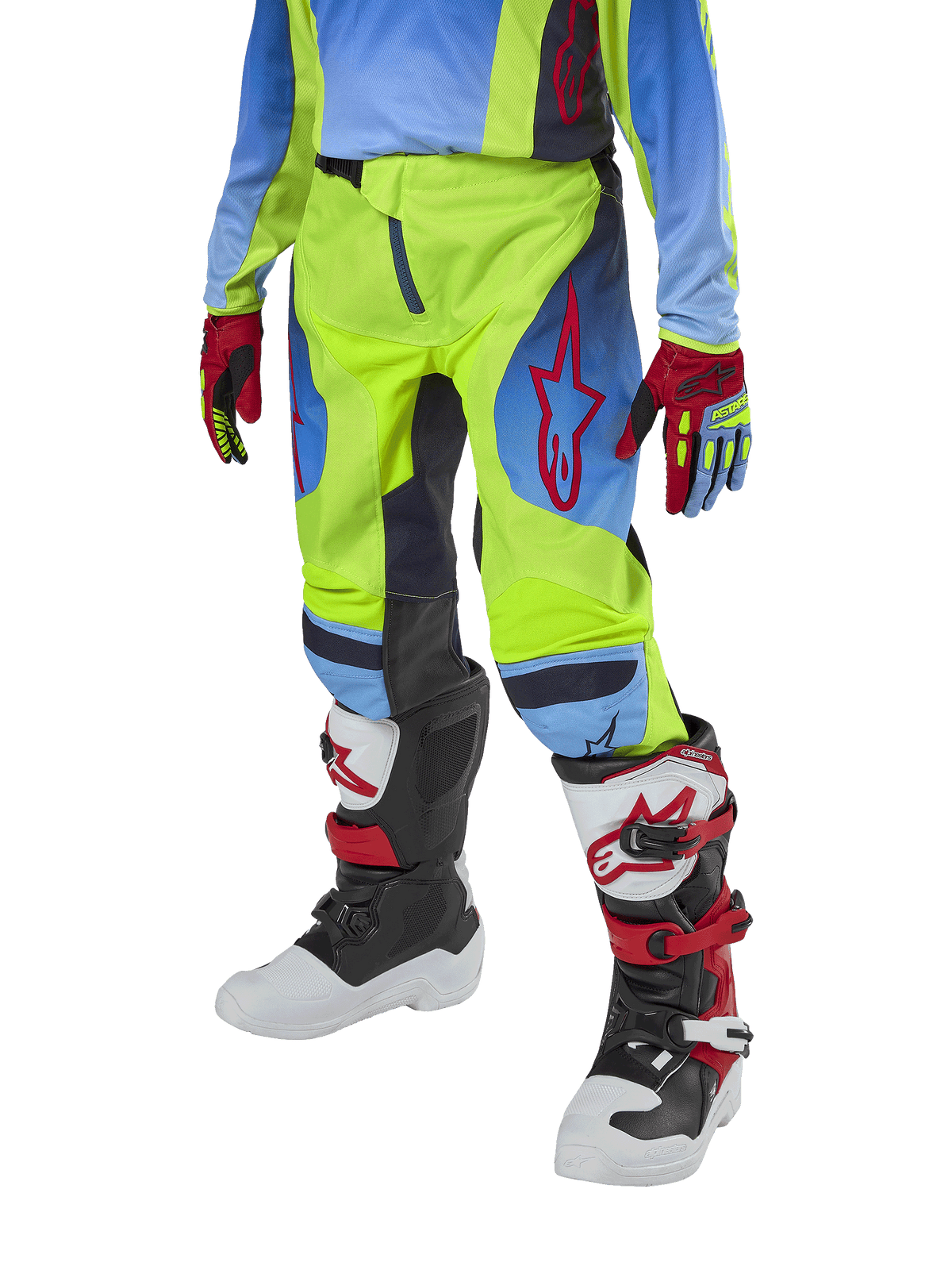 Alpinestars Youth 2024 Racer Hoen Pants, motocrossbyxor för ungdomar, neongula och marinblå med röda detaljer, bärs med matchande handskar och stövlar i vitt, svart och rött, sportig passform och förböjda ben för terrängkörning
