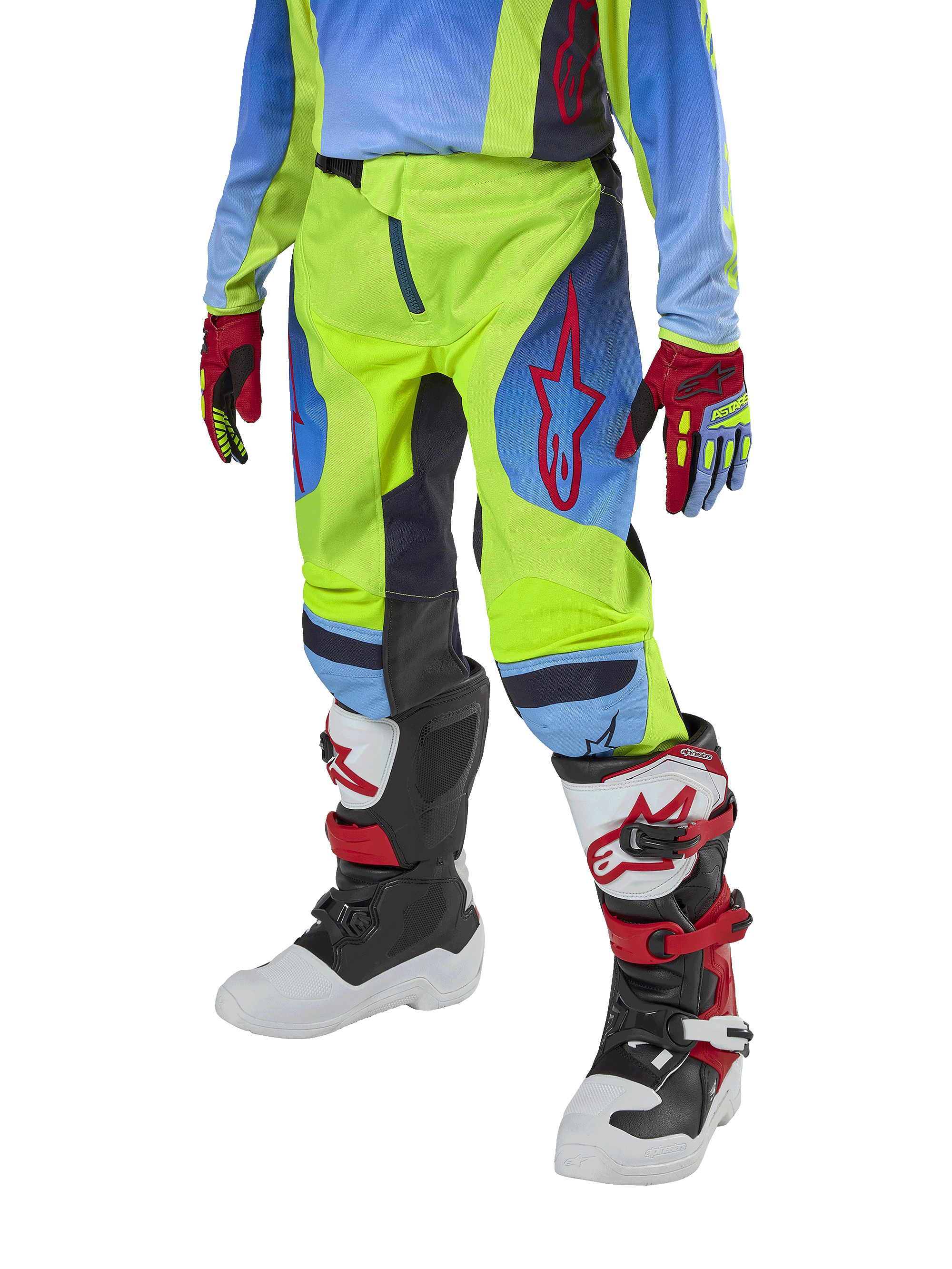 Alpinestars Youth 2024 Racer Hoen Pants, motocrossbyxor för ungdomar, neongula och marinblå med röda detaljer, bärs med matchande handskar och stövlar i vitt, svart och rött, sportig passform och förböjda ben för terrängkörning