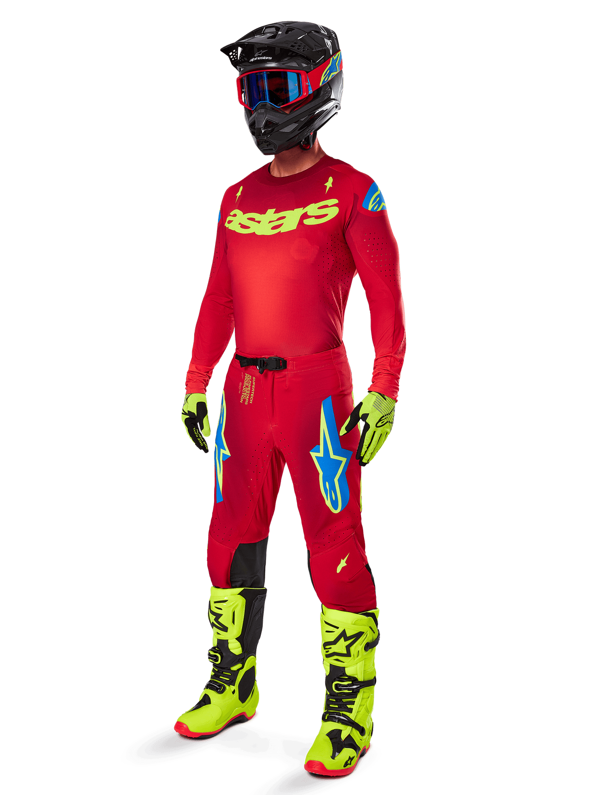 Alpinestars Supertech Maker Gear Set 2025, komplett motocross-outfit, röd tröja och byxor med gula och blå detaljer, neongula stövlar och handskar, svart hjälm med blå goggles, professionell högpresterande utrustning för terrängkörning