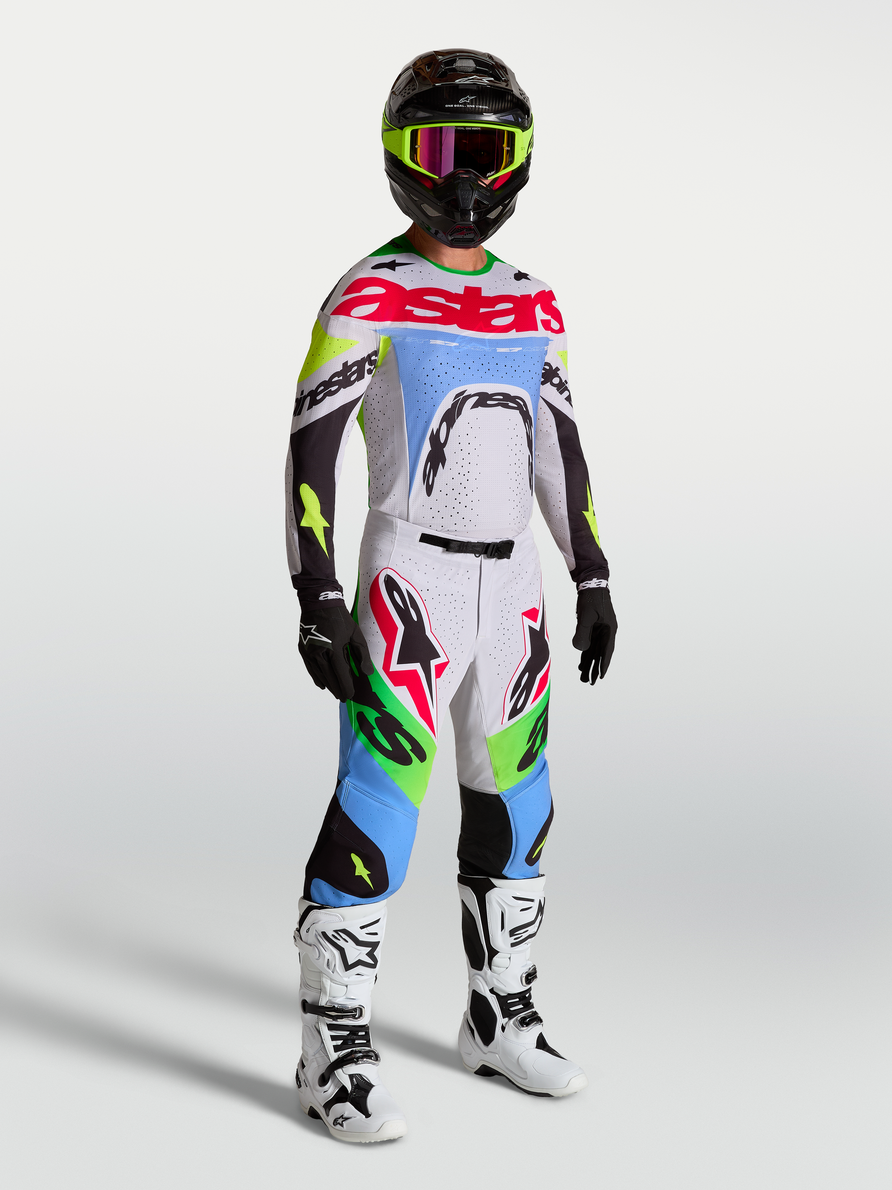 Alpinestars 2027 Supertech Dyna tröja och MX-ställ för herr, ljus lila och grön fluo, atletisk racingpassform på modell.