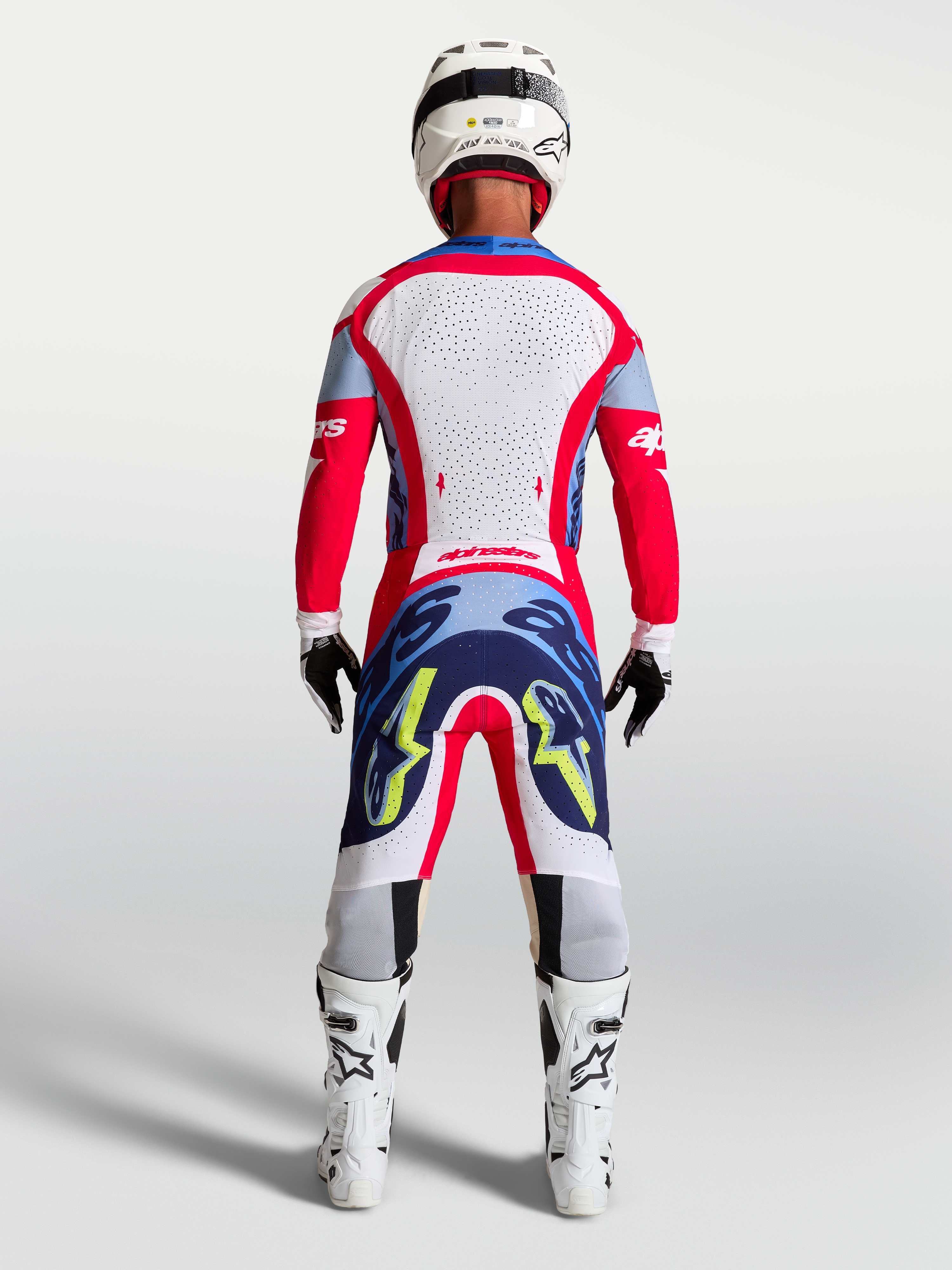 Alpinestars Supertech Dyna tröja och 2027 Supertech Dyna Gear Set, röd och vit motocross-outfit för herr, vy bakifrån.