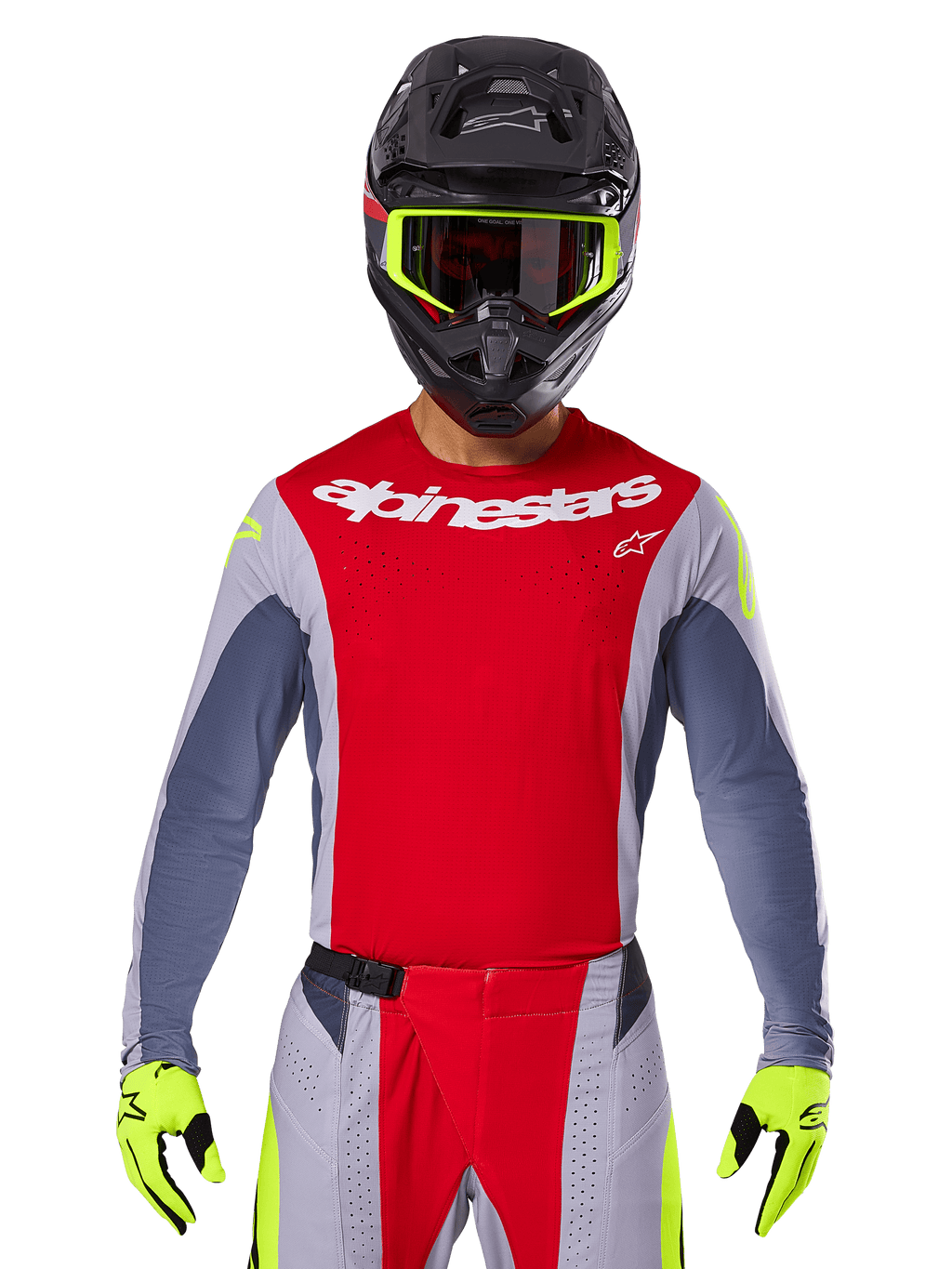 Motocrossförare klädd i 2025 Techstar Melt-tröja och matchande byxor, röd och grå med vit Alpinestars-logotyp, svart hjälm med neongula goggles, matchande neongula handskar, ventilerad prestandautrustning för terrängkörning