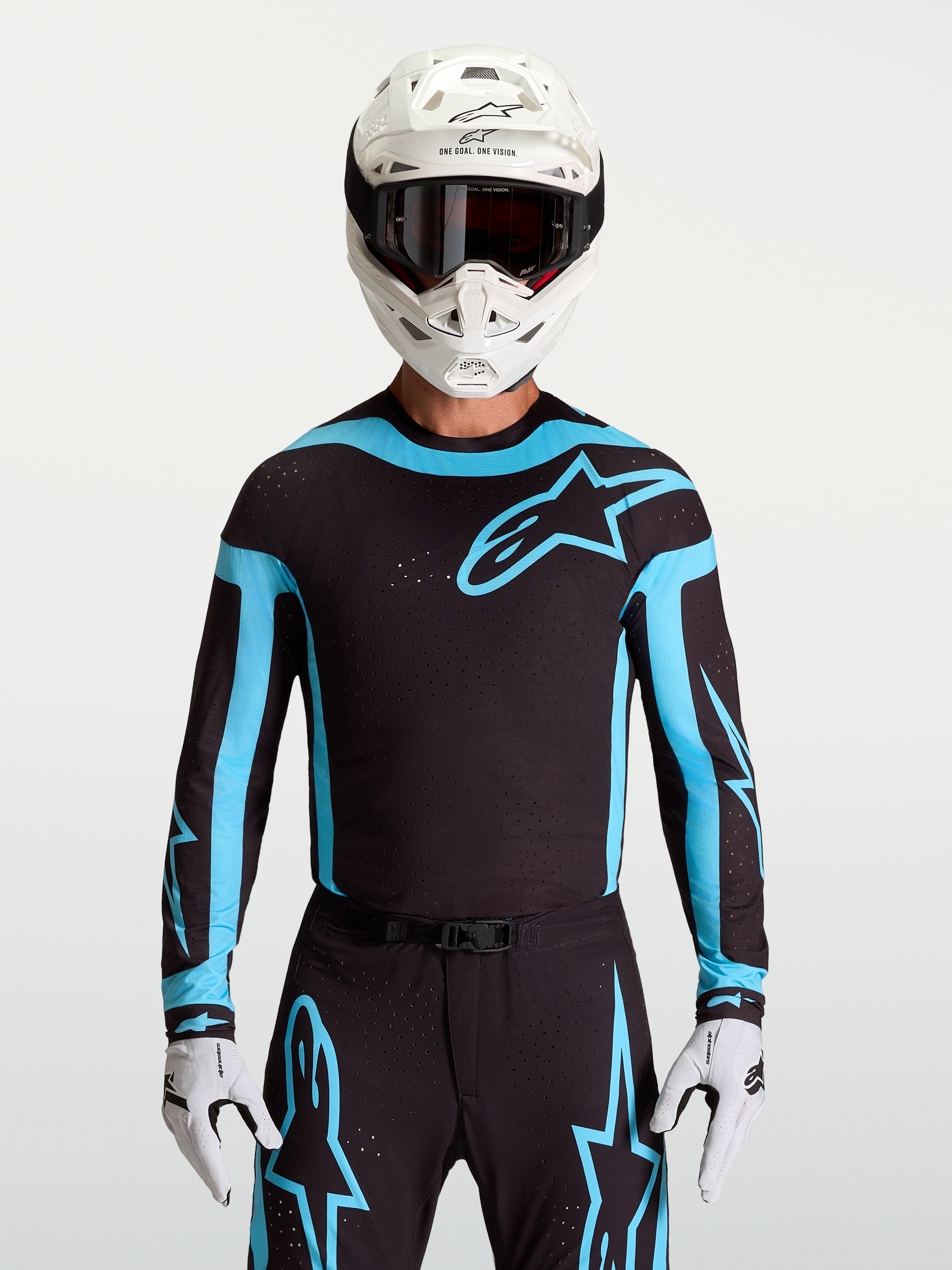 Alpinestars Supertech Vesta tröja, svart och turkos motocrosströja för herr med ventilerande laserskurna perforeringar.