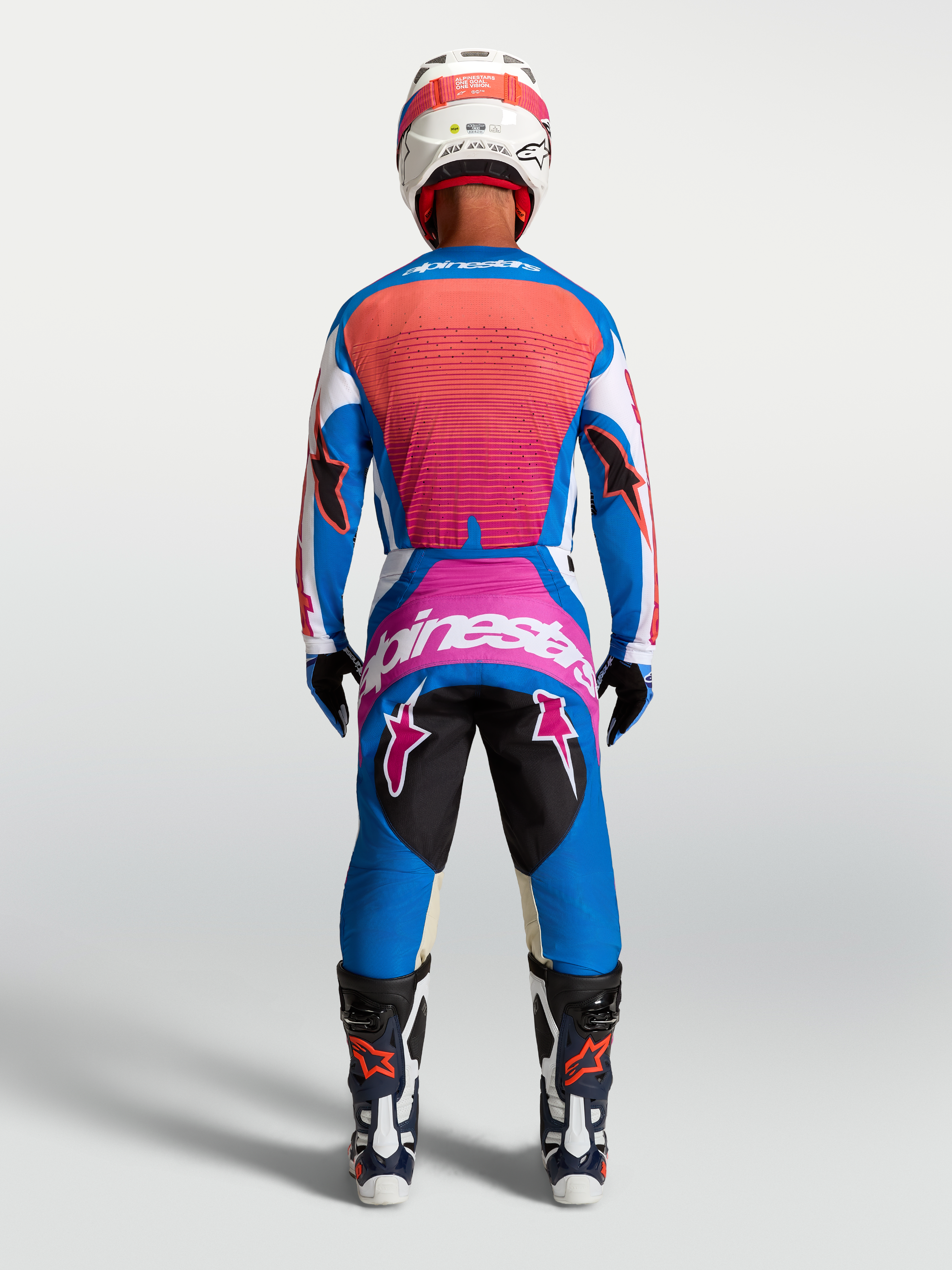 Alpinestars Techstar Maven tröja och utrustningsset, blå och hot coral motocrossutrustning, vy bakifrån.