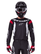 Alpinestars 2025 Fluid Haul tröja och utrustningsset, svart och vit herrmotocrossutrustning med röda detaljer.