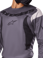 Alpinestars 2025 Fluid Haul Jersey, Motocross Jersey, Gray with black and white accents, featuring the Alpinestars logo and wordmark on the chest, sport fit for off-road racing.