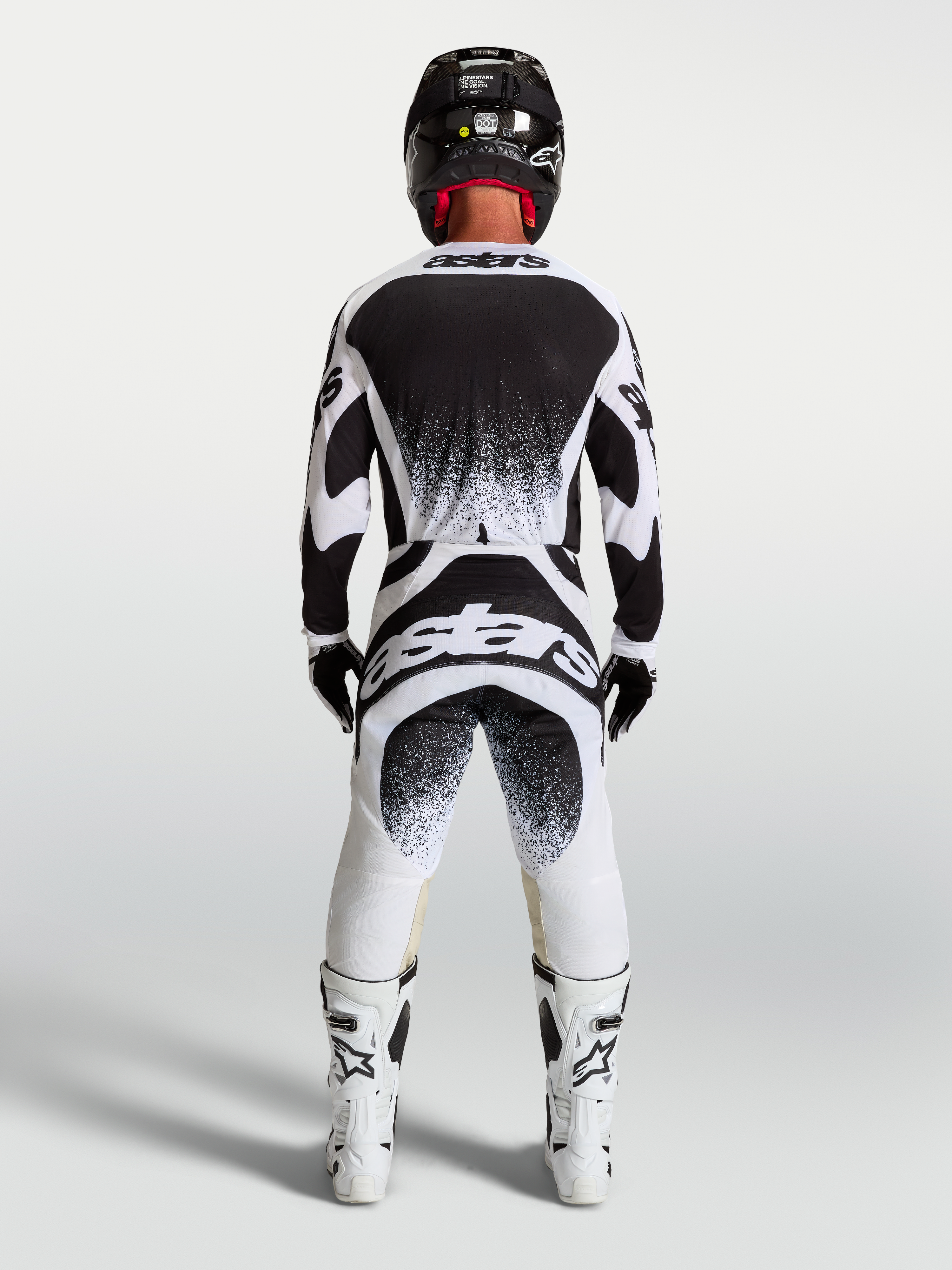 Alpinestars Techstar Swan Jersey and Gear Set, Men's Motocross Outfit in White and Black featuring rear splatter graphics.
