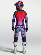 Alpinestars 2027 Racer Air Hunt Gear Set, purple and red ventilated motocross jersey and pants, rear view on rider.