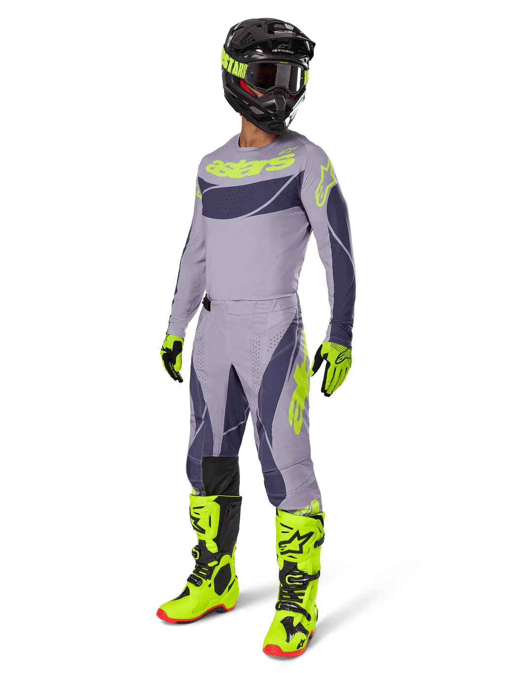 Motocrossförare i 2025 Techstar Dreem Jersey i grått och mörkgrått med neongula detaljer, komplett racingutrustning inklusive matchande grå byxor, neongula stövlar och handskar och en svart hjälm, koordinerad offroad-prestandaoutfit