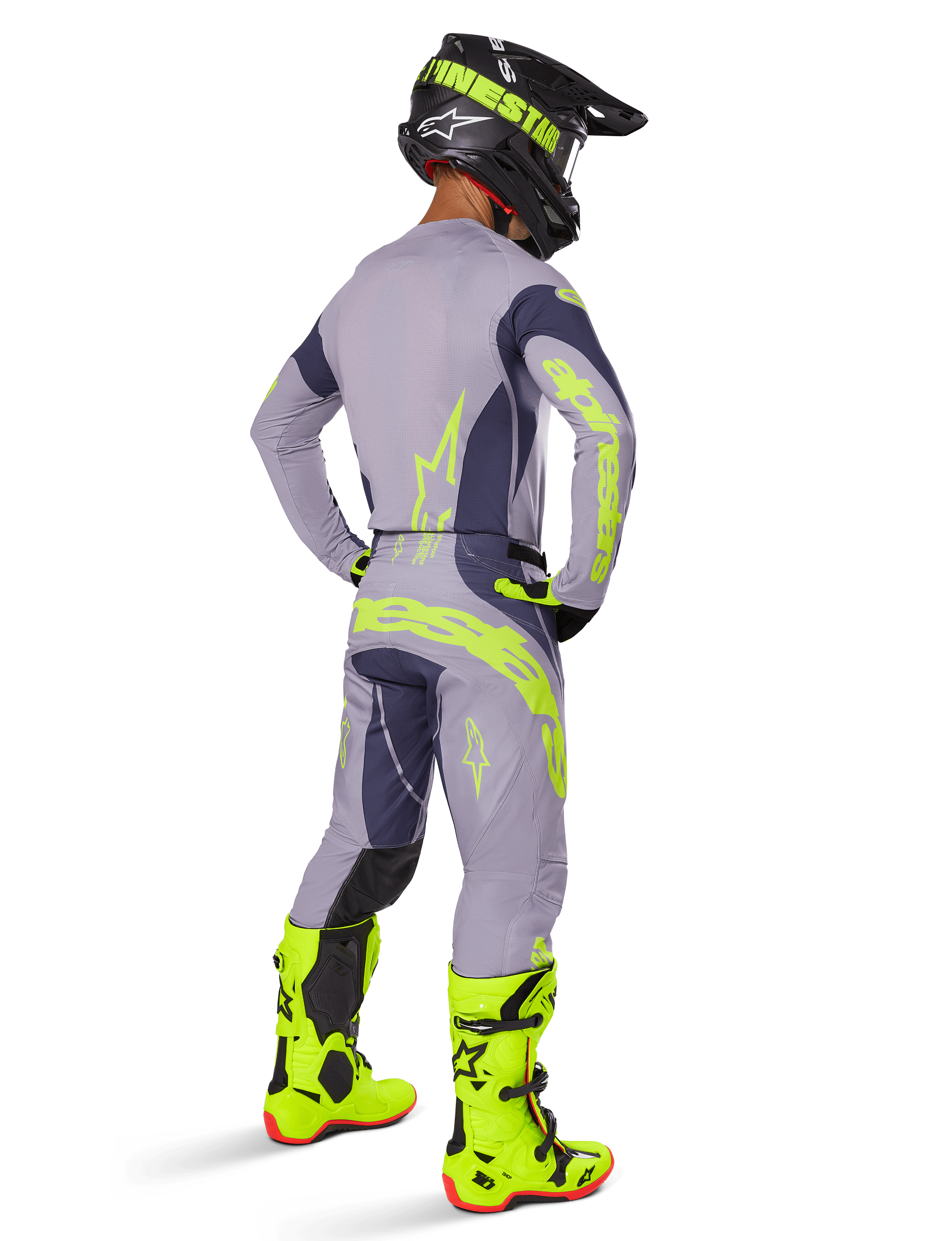Alpinestars 2025 Techstar Dreem tröja, motocrosströja, grå och mörkgrå, bärs med matchande byxor och neongula stövlar, vy bakifrån som visar neongul branding och atletisk passform för terrängkörning