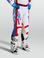 Alpinestars Racer Hunt Pants, motocross racing pants in White, Red, and Blue with pre-curved legs and leather inner knees.
