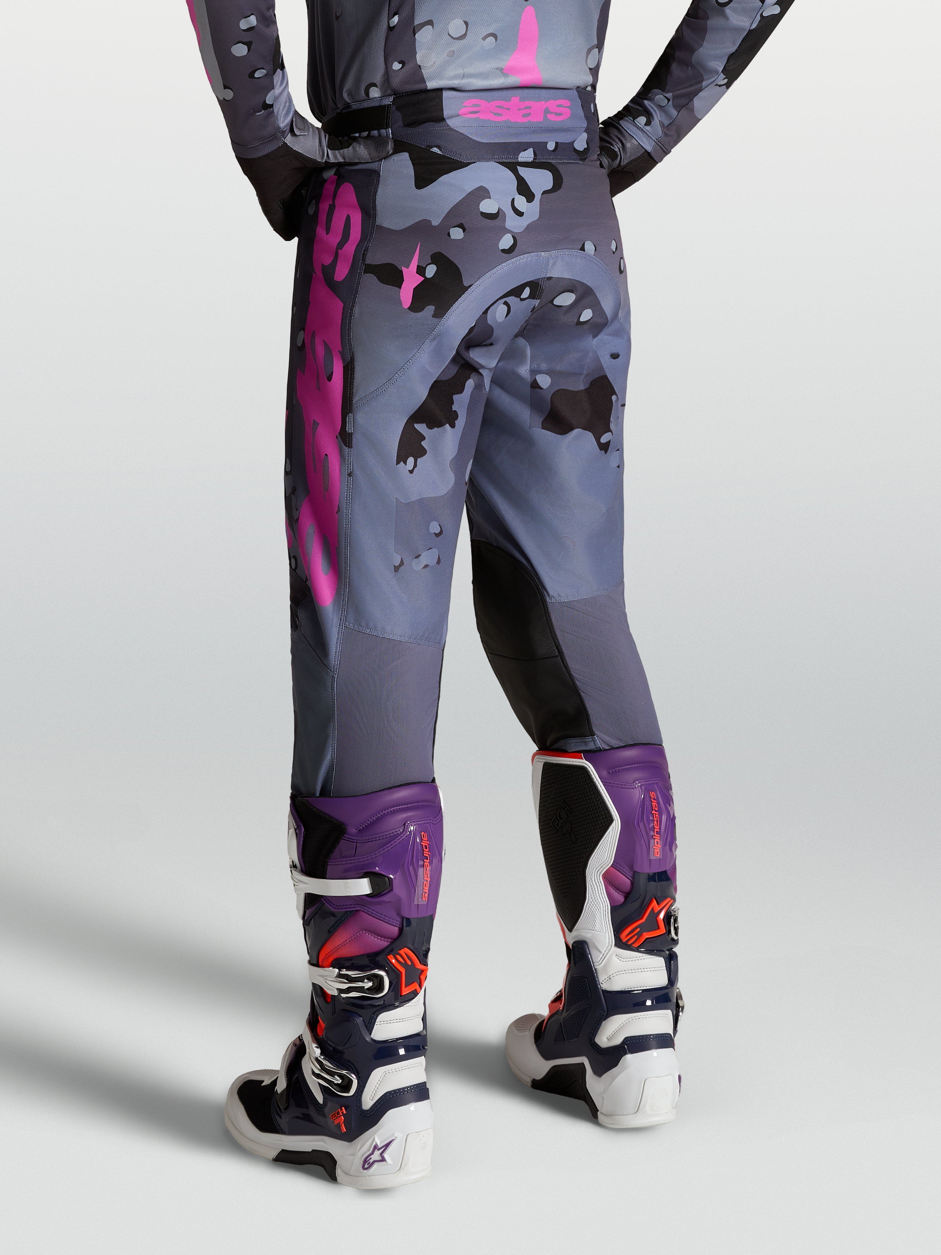 Alpinestars Racer Lone Pants, motocross riding pants in gray camo and purple, on-model rear view with Tech 7 boots.