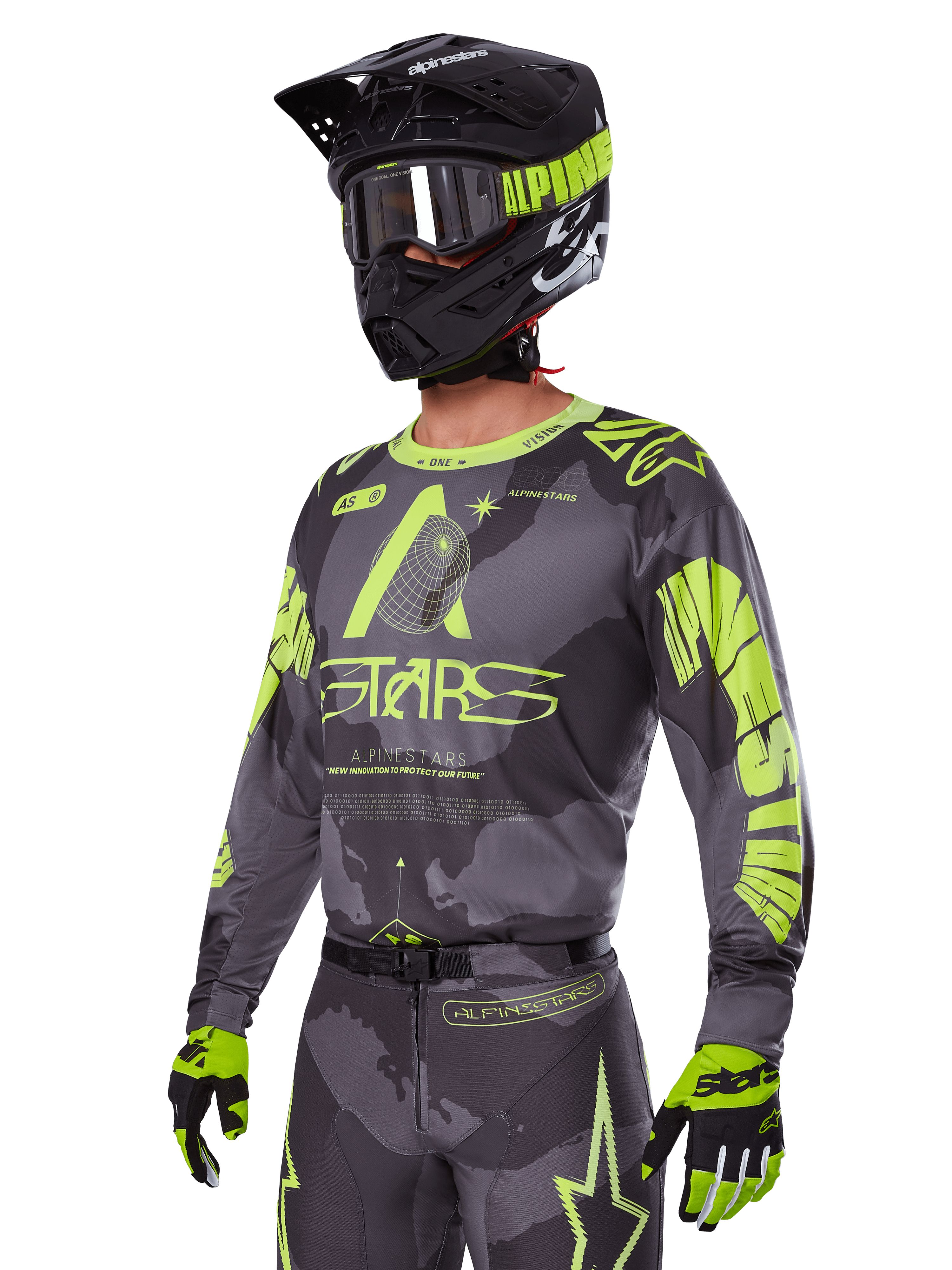 Alpinestars 2025 Racer Hollow-utrustningsset, motocrosströja och byxor i grått och neongult, bärs med matchande svart hjälm, goggles och handskar, med framträdande neongula Alpinestars-logotyper och stjärngrafik på en mönstrad grå bas, koordinerad professionell racinglook för terrängkörning