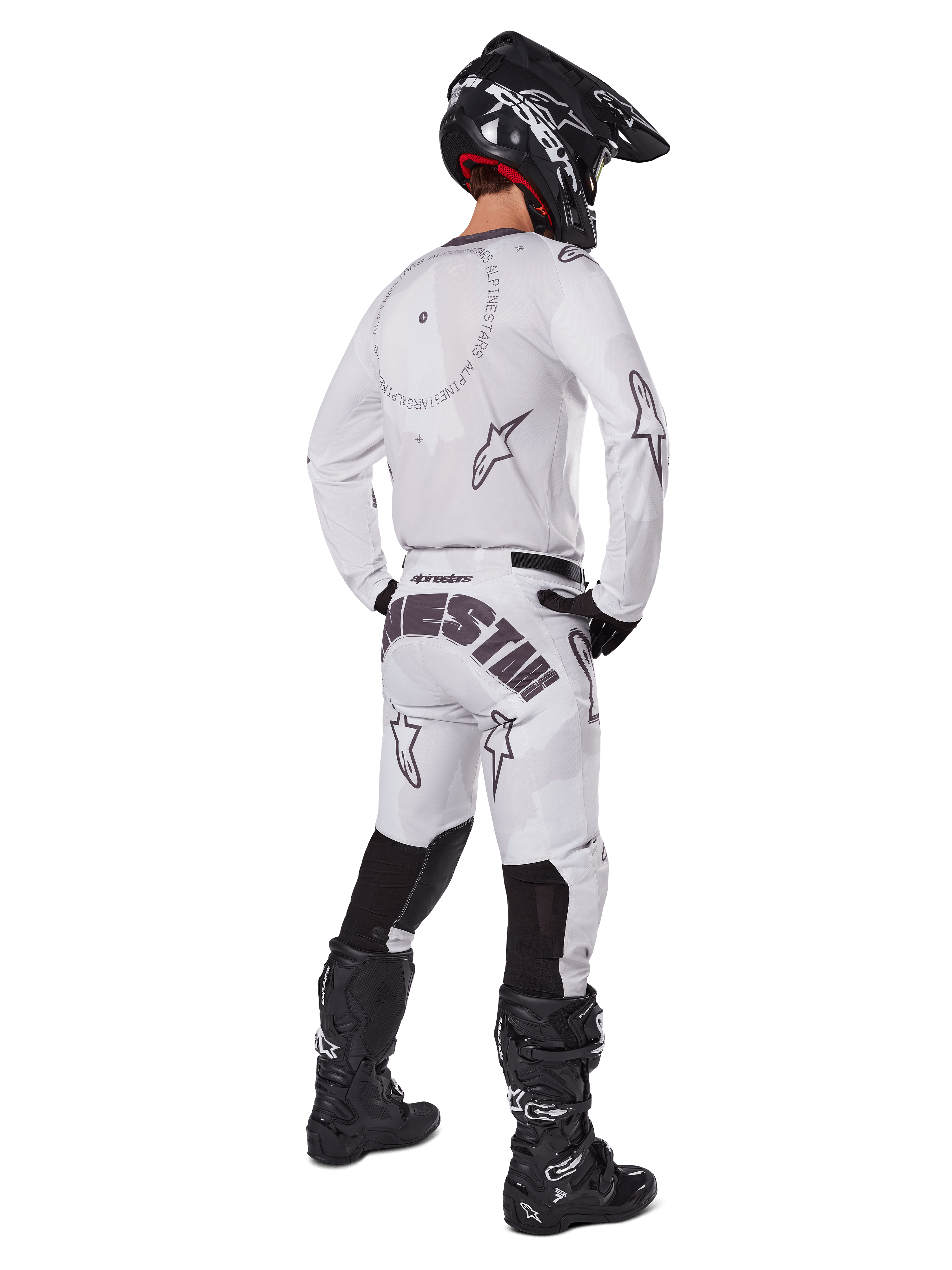 Alpinestars 2025 Racer Hollow Gear Set, White, rear view of a motocross rider wearing white jersey and pants with black branding, black helmet, and black boots, coordinated professional off-road racing outfit