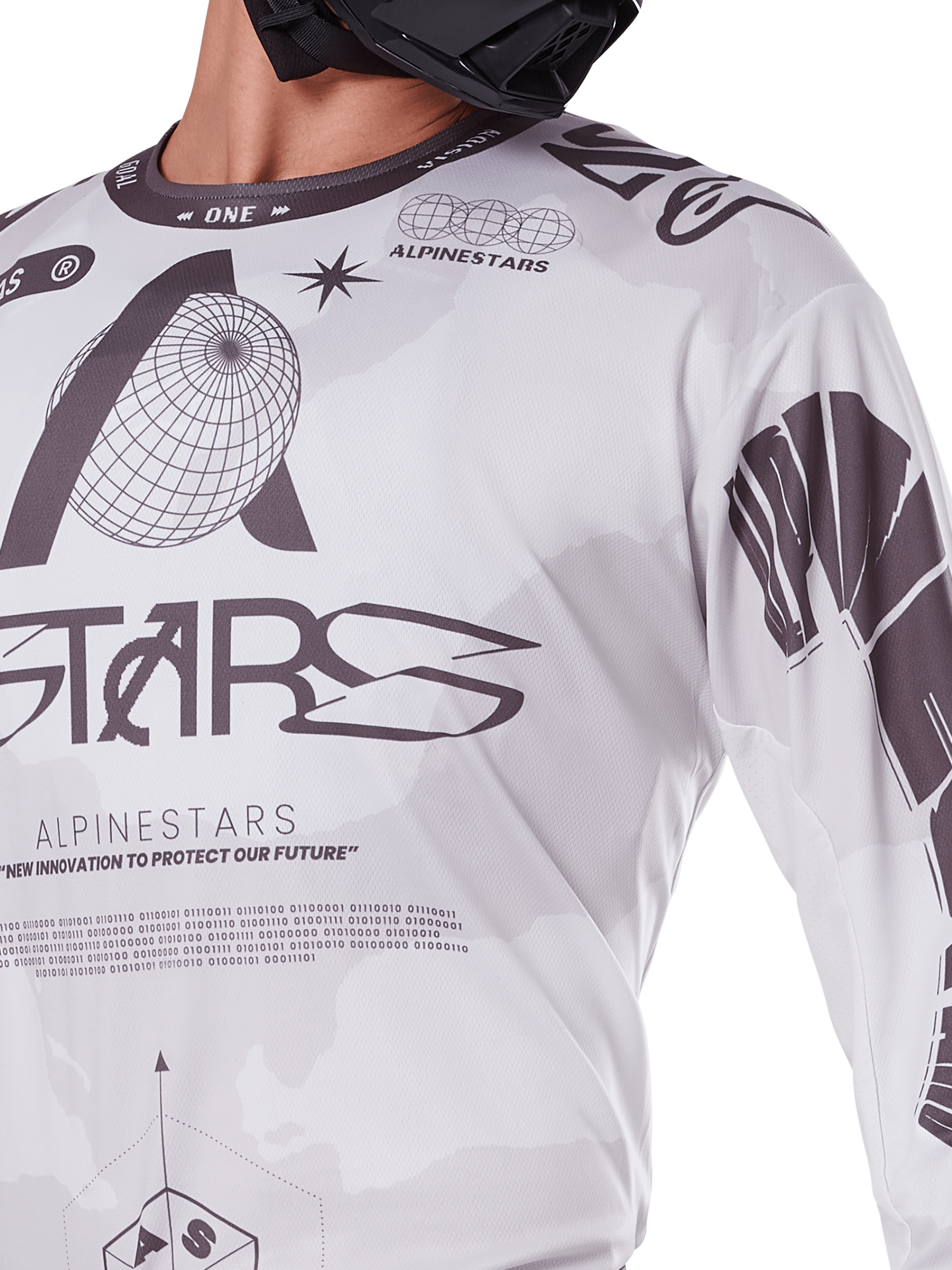 Close-up of Alpinestars 2025 Racer Hollow Jersey, White and Grey, featuring black graphic prints with globe logo and binary code, technical motocross apparel for off-road riding