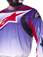 Alpinestars 2025 Fluid Wurx Jersey, Motocross Jersey, Purple and Bright Red, close-up of rider wearing jersey with large red Alpinestars star logo on chest, black and red curved graphic accents, athletic fit for off-road racing