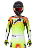 Alpinestars 2025 Fluid Wurx Jersey, Motocross Jersey, Neon Yellow Orange and White, worn with matching pants and black helmet with red goggles, complete MX gear ensemble on rider