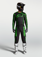 Alpinestars Fluid Apex V2 byxor, motocrossutrustning för herr, svart och grön fluo, komplett racingoutfit med vita stövlar.
