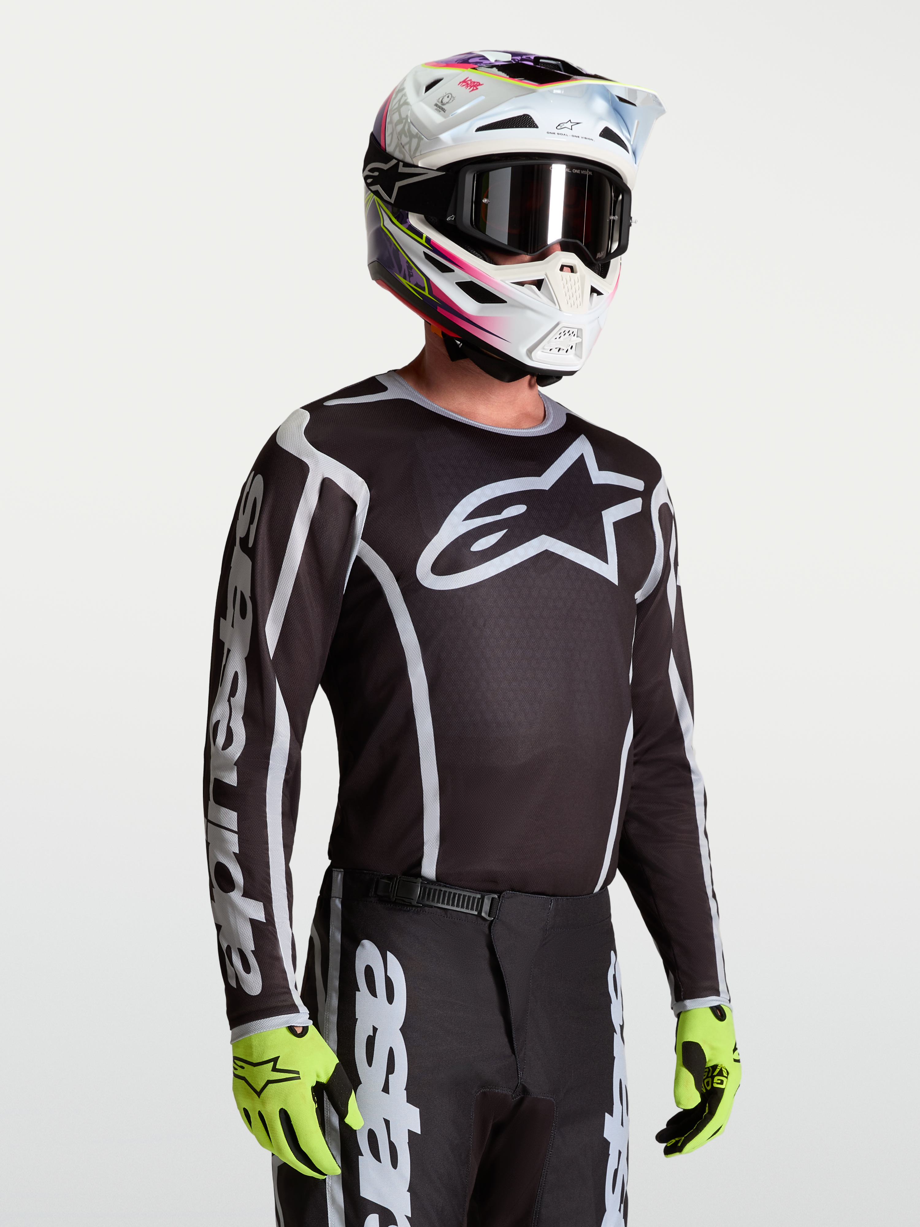 Alpinestars Fluid Apex V2 tröja för herrar, svart och silver, andningsbart fukttransporterande polytyg för terrängkörning.