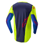 Alpinestars 2024 Racer Hoen-tröja, motocrosströja, Yellow Fluo och Blue Night Navy, sedd bakifrån visar mörkblå centralpanel med röd logotyp, neongula sidosektioner, långa ärmar och ventilerande meshmaterial designat för terrängkörning.