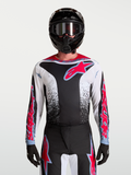 Alpinestars Fluid Drag tröja, svart och vit herr-motocrosströja med röda detaljer och aggressiv grafik på modell.