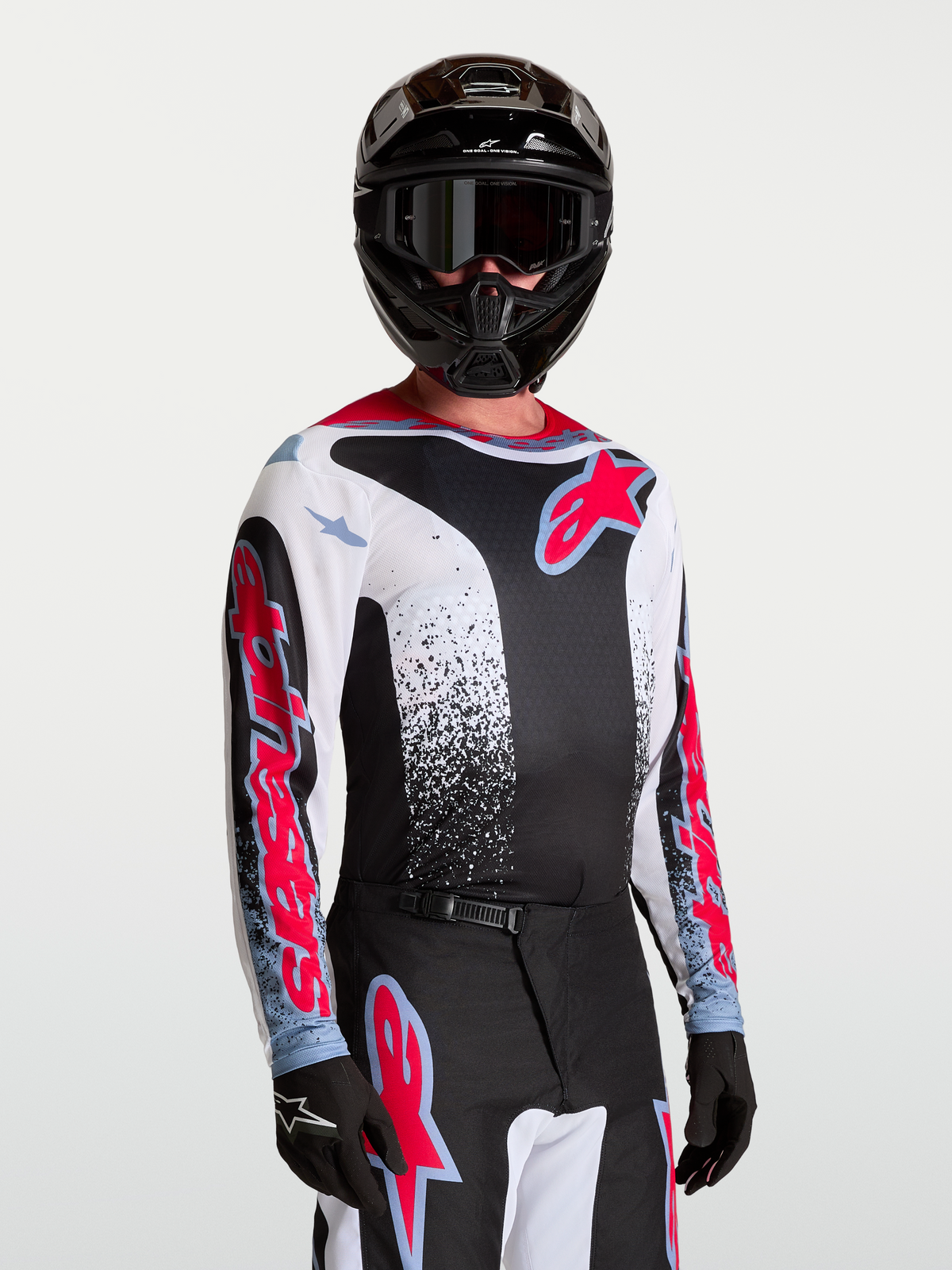 Alpinestars Fluid Drag tröja, svart och vit motocrosströja för herr med röda och blå detaljer, lättviktigt material
