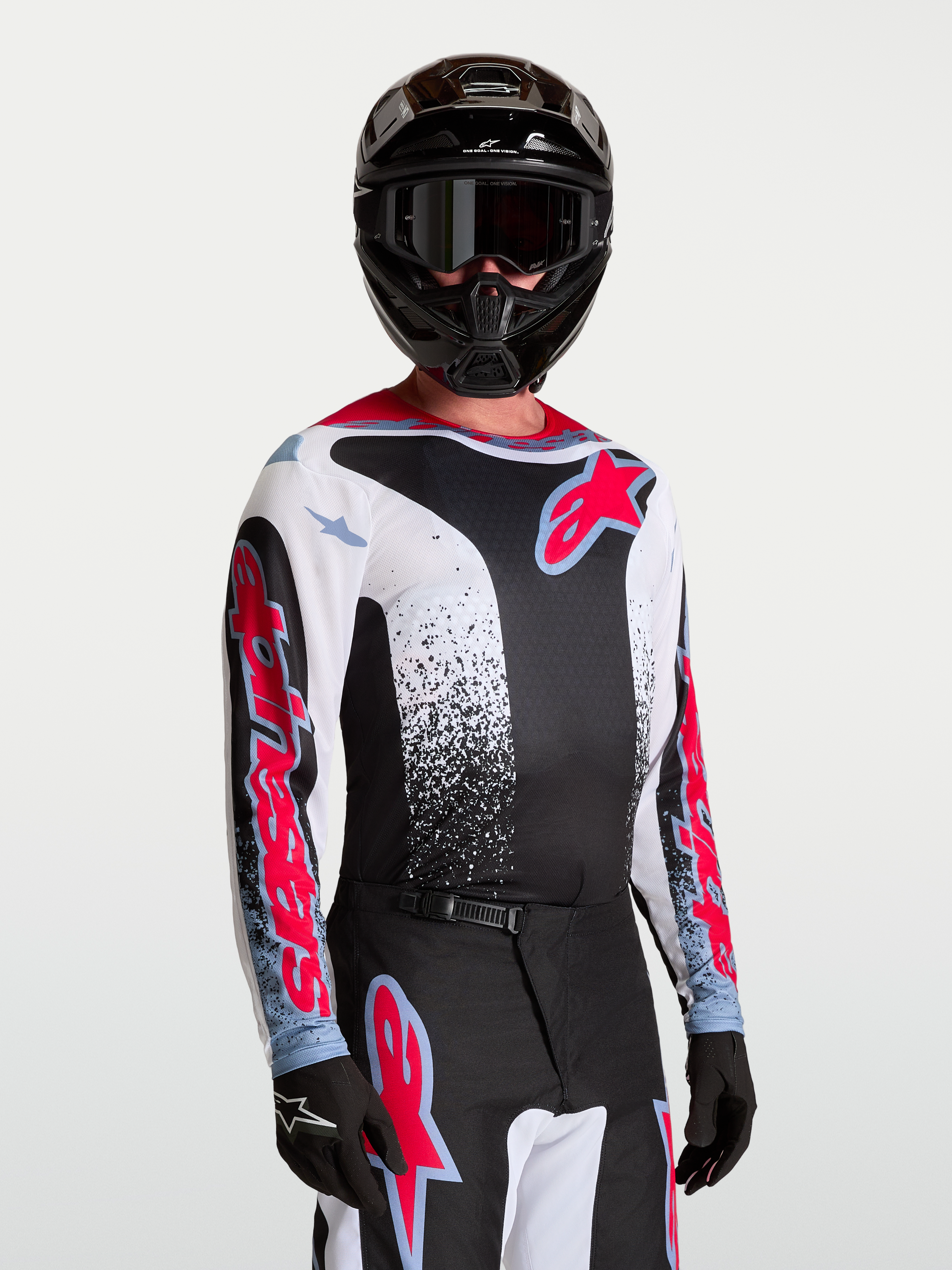 Alpinestars Fluid Drag tröja, svart och vit motocrosströja för herr med röda och blå detaljer, lättviktigt material