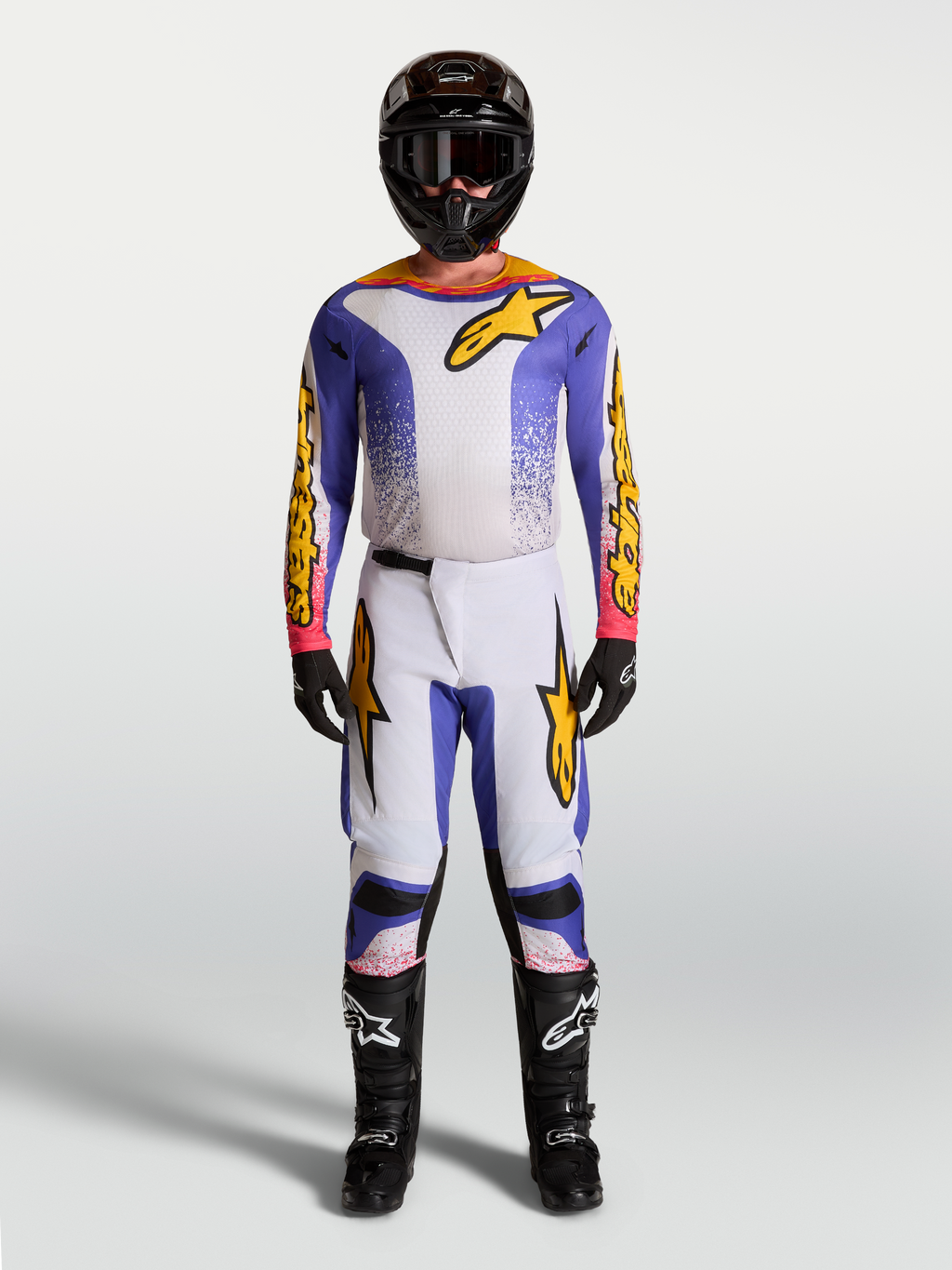 Alpinestars Fluid Drag tröja och klädset, motocrossutrustning för herr, blå och guld, ergonomiskt stretchmaterial, matchande outfit för off-road och terrängkörning.