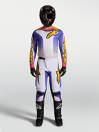 Alpinestars Fluid Drag tröja och klädset, motocrossutrustning för herr, blå och guld, ergonomiskt stretchmaterial, matchande outfit för off-road och terrängkörning.