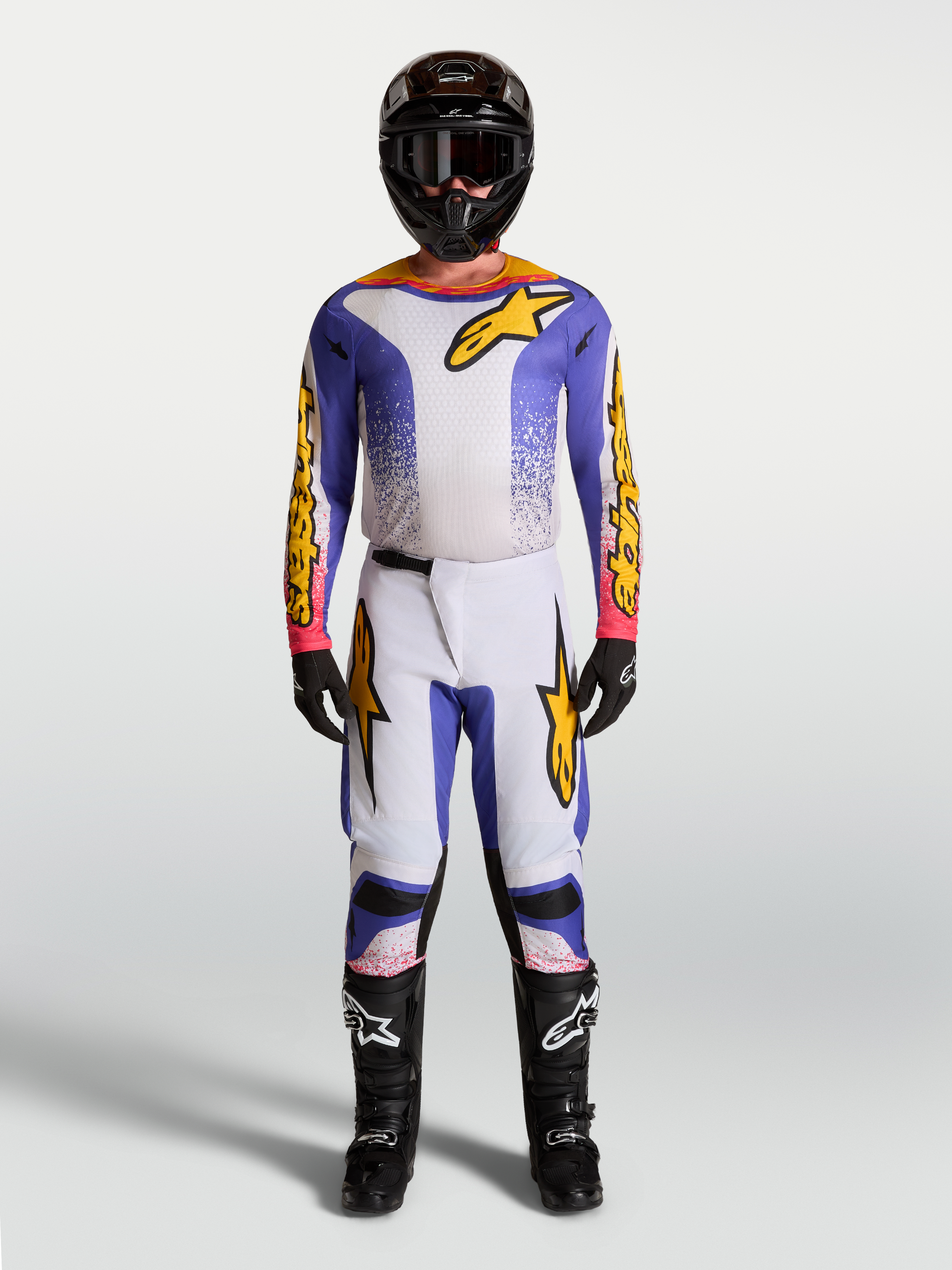 Alpinestars Fluid Drag tröja och klädset, motocrossutrustning för herr, blå och guld, ergonomiskt stretchmaterial, matchande outfit för off-road och terrängkörning.
