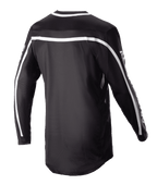 Alpinestars 2023 Racer Found Jersey, Black Motocross Jersey, Rear view featuring white stripes across the shoulders and sleeves, long sleeve design with a dropped tail for coverage, lightweight and breathable performance gear