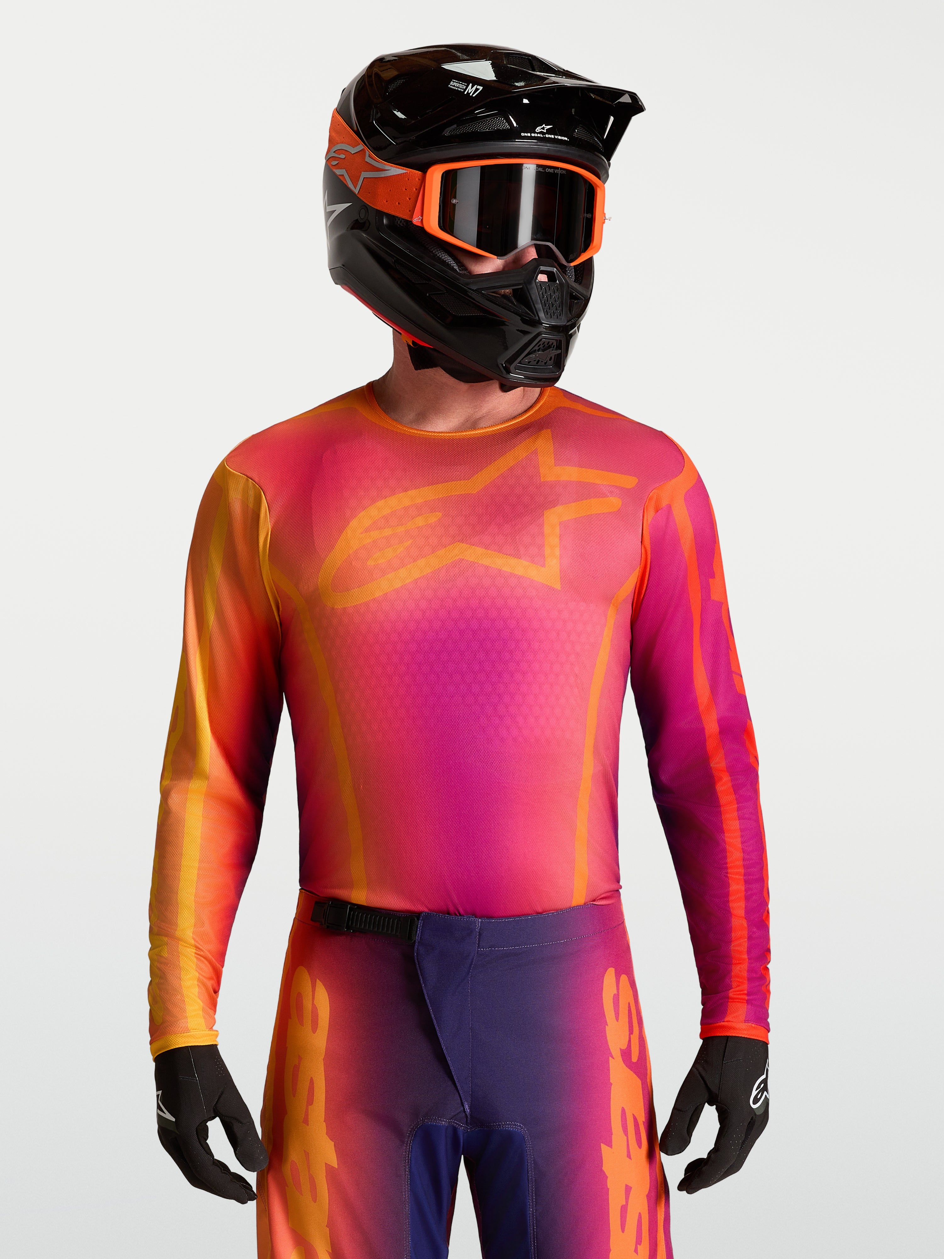 Alpinestars Fluid Kepler tröja, lila och orange motocrosströja med fukttransporterande material och atletisk passform.