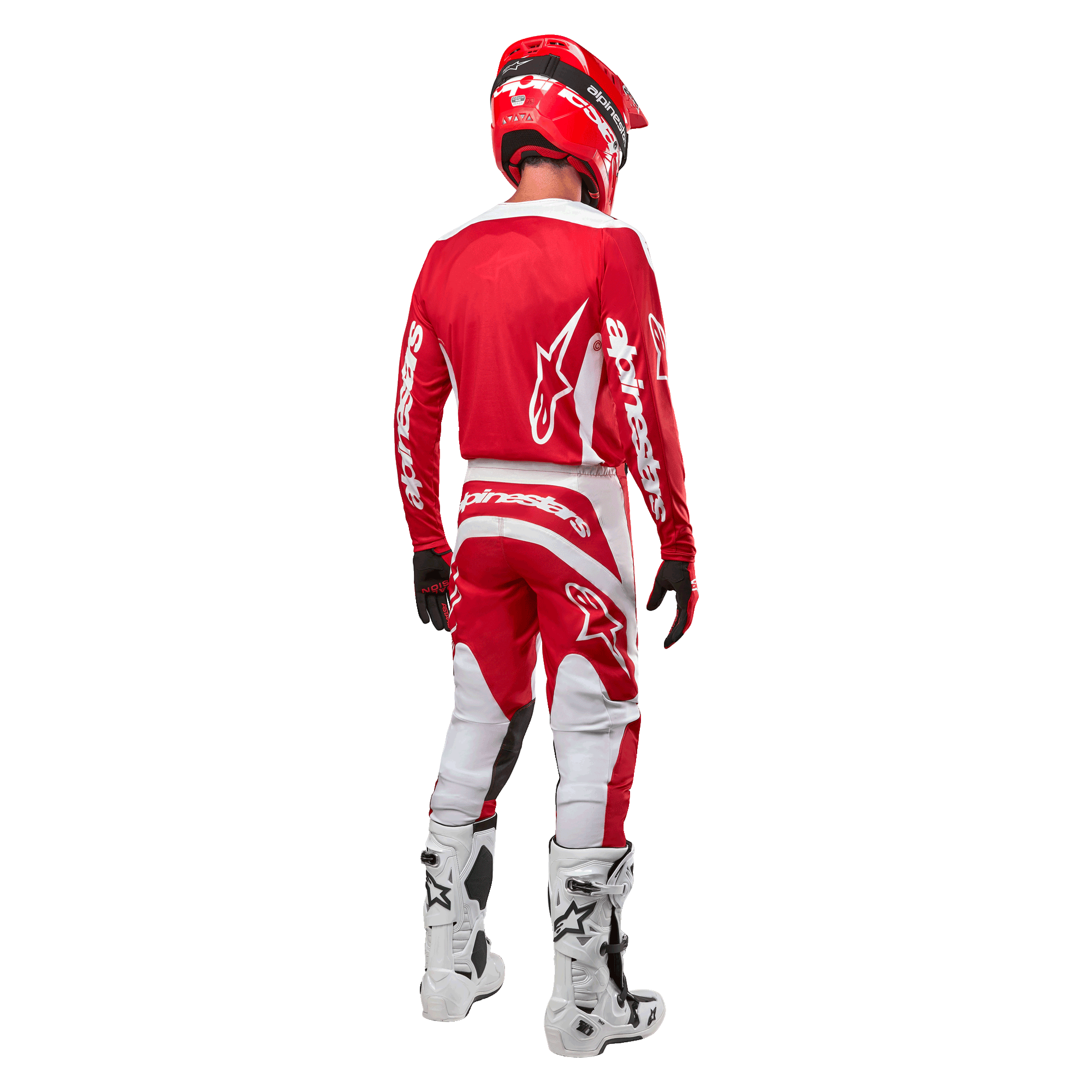 Vy bakifrån på en motocrossförare iklädd Alpinestars 2024 Fluid Lurv-tröja i Mars Red White, kombinerad med matchande röda och vita byxor, vita offroad-stövlar och en röd hjälm, som visar tröjans ryggdesign och Alpinestars logotyper.