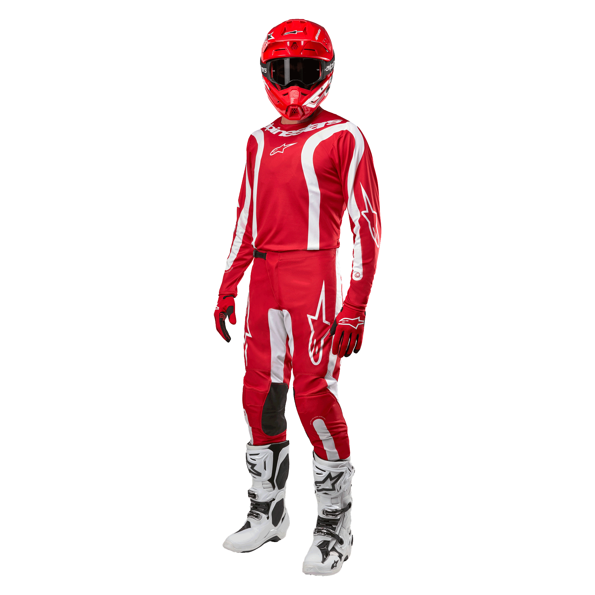 Motocrossförare i komplett racingutrustning, Alpinestars 2024 Fluid Lurv-tröja i Mars Red och vitt, matchande röda byxor med vita detaljer, röd hjälm, röda handskar och vita och svarta stövlar, koordinerad outfit för terrängkörning