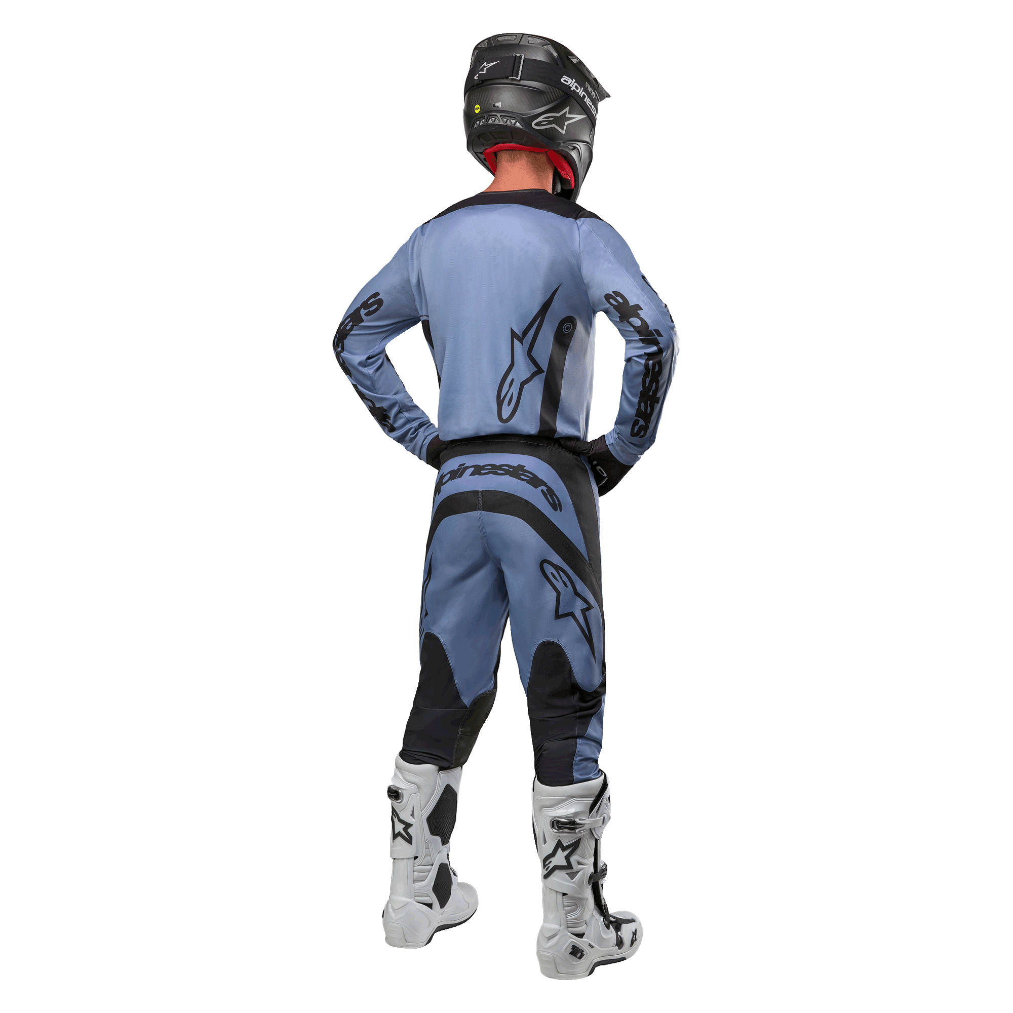 Motocross rider from behind wearing the Alpinestars 2024 Fluid Lurv Jersey and matching pants in Light Blue and Black, featuring black branding on the back and sleeves, paired with a black helmet and white boots.