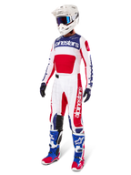 Alpinestars Limited Edition Techstar Fortitude Gear Set, Motocross Outfit, Red White and Blue, featuring a white jersey with bold graphics, matching race pants, white helmet with goggles, and coordinated blue and red boots, professional racing gear for off-road performance