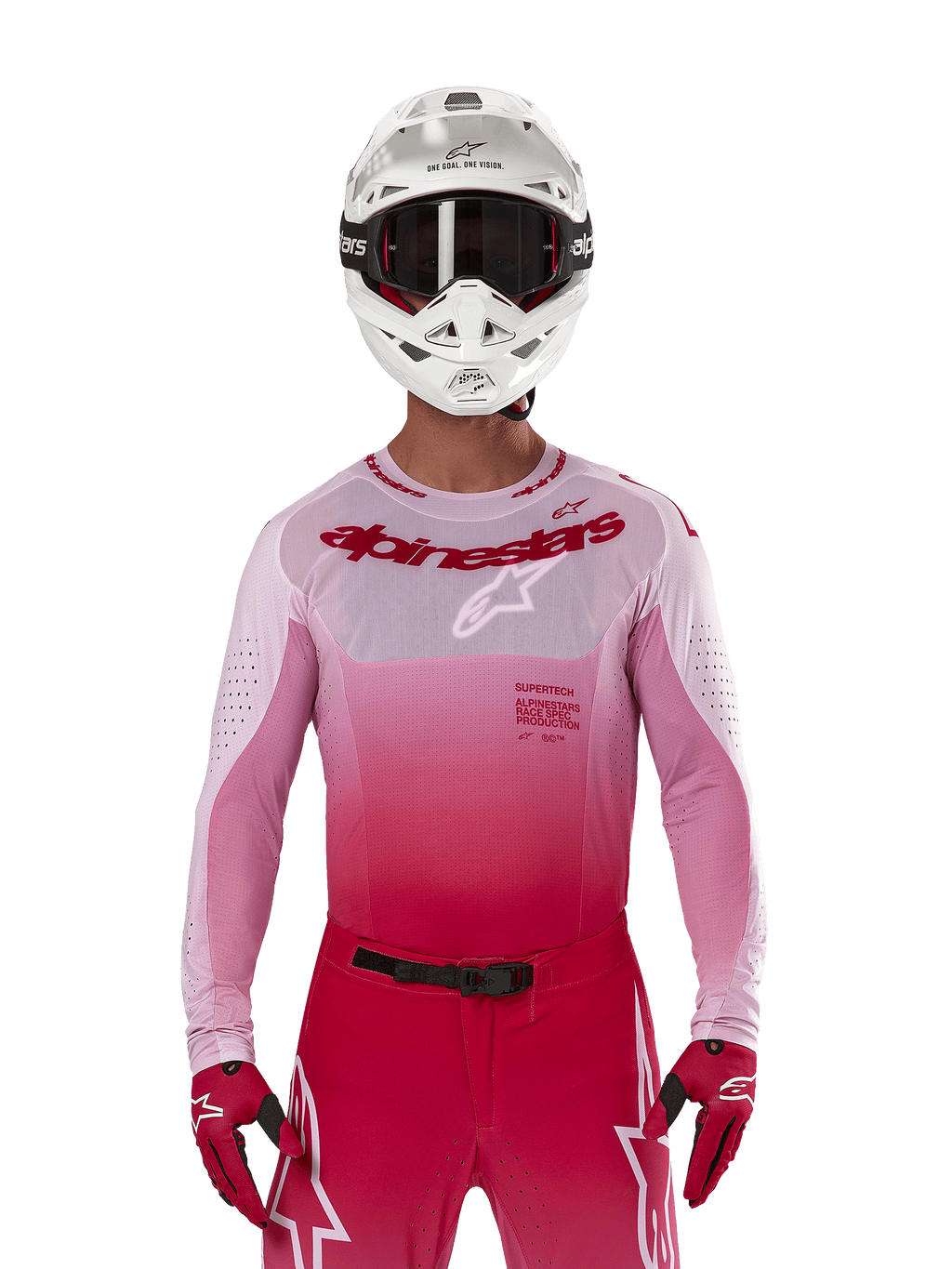 Motocross rider wearing Alpinestars 2024 Supertech Dade Jersey in Red Berry Lilac, matching pants, white helmet with black goggles, and red gloves, coordinated professional racing outfit with gradient pink and red tones