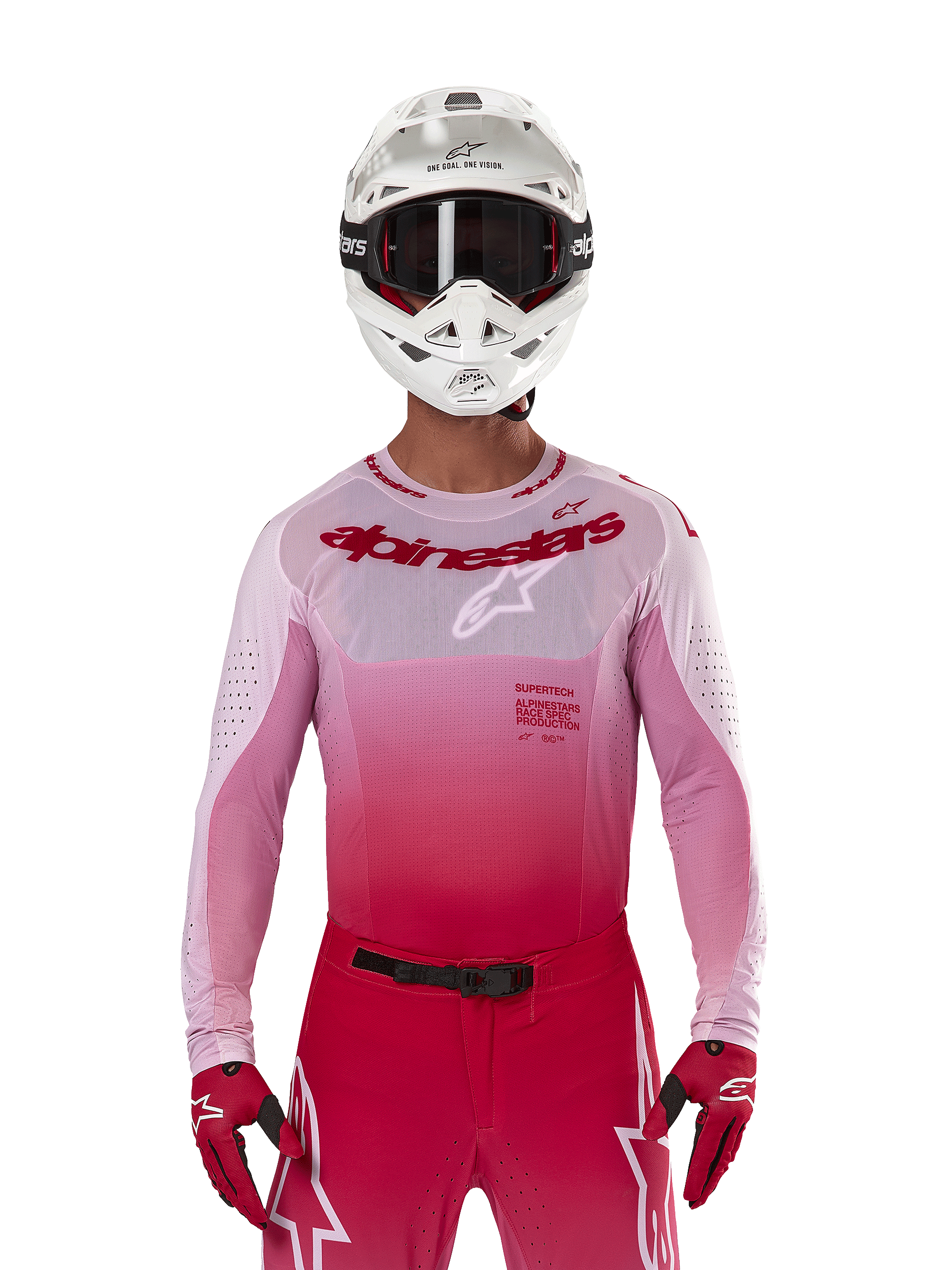 Motocross rider wearing Alpinestars 2024 Supertech Dade Jersey in Red Berry Lilac, matching pants, white helmet with black goggles, and red gloves, coordinated professional racing outfit with gradient pink and red tones