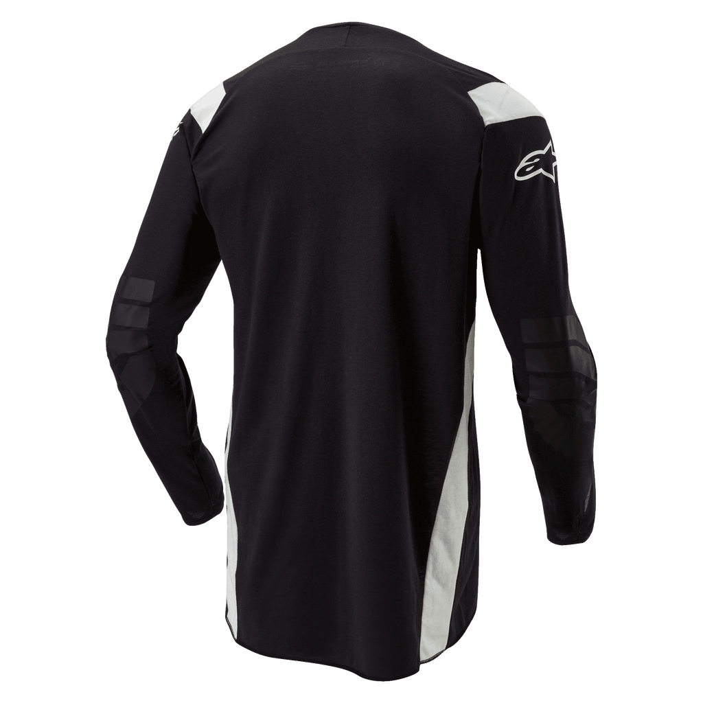 Alpinestars Techdura-tröja, enduro- och motocrosströja, svart med vita detaljer, vy bakifrån med förlängd rygg, förstärkta armbågar och vit Alpinestars-logotyp på ärmen, hållbara kläder för terrängkörning
