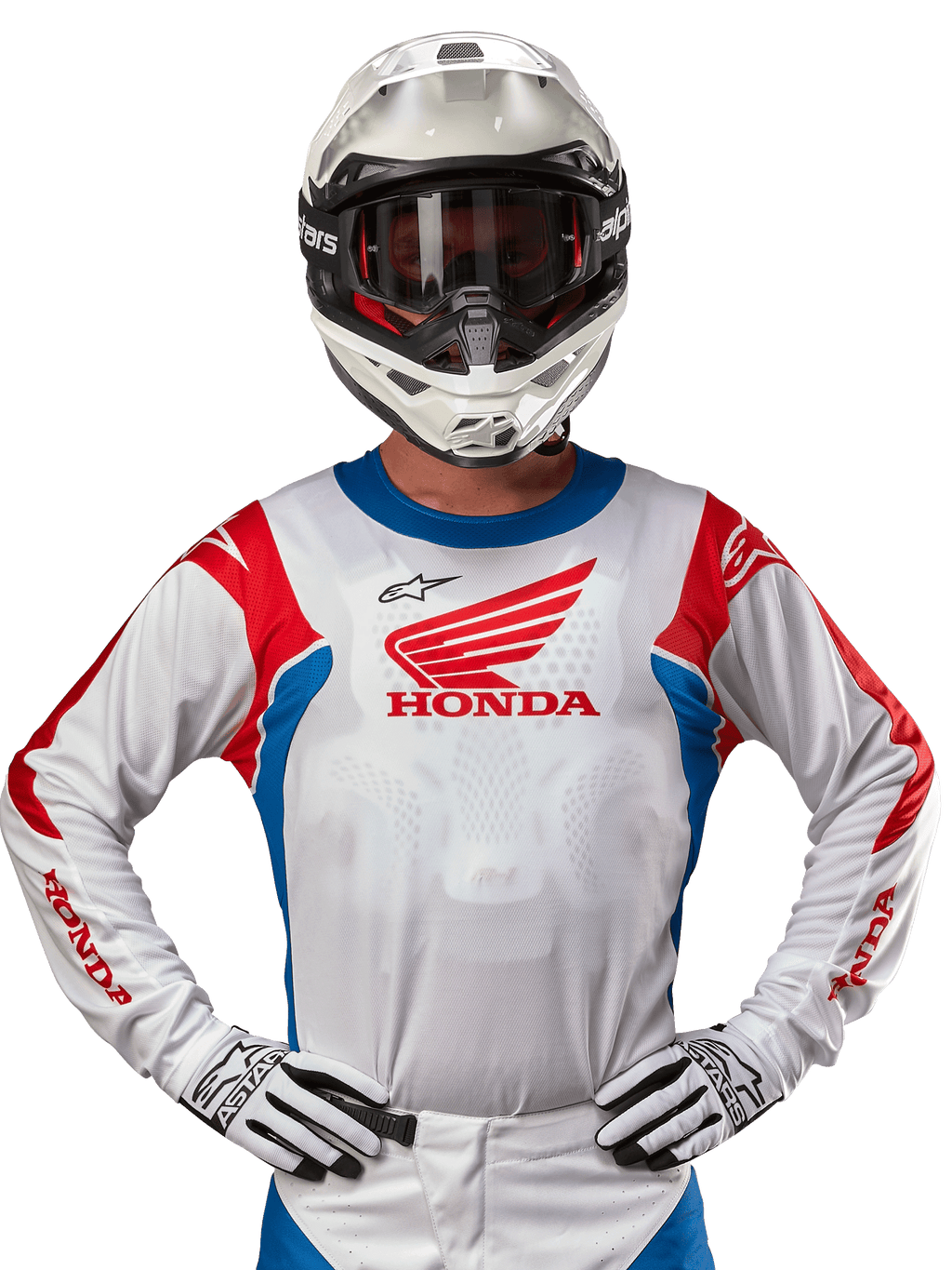 Alpinestars Honda Racer Iconic tröja, vit motocrosströja med röd Honda-logotyp och klarblå och röda detaljer, bärs av en förare med vit hjälm och handskar, prestandautrustning för offroad- och motocrossracing